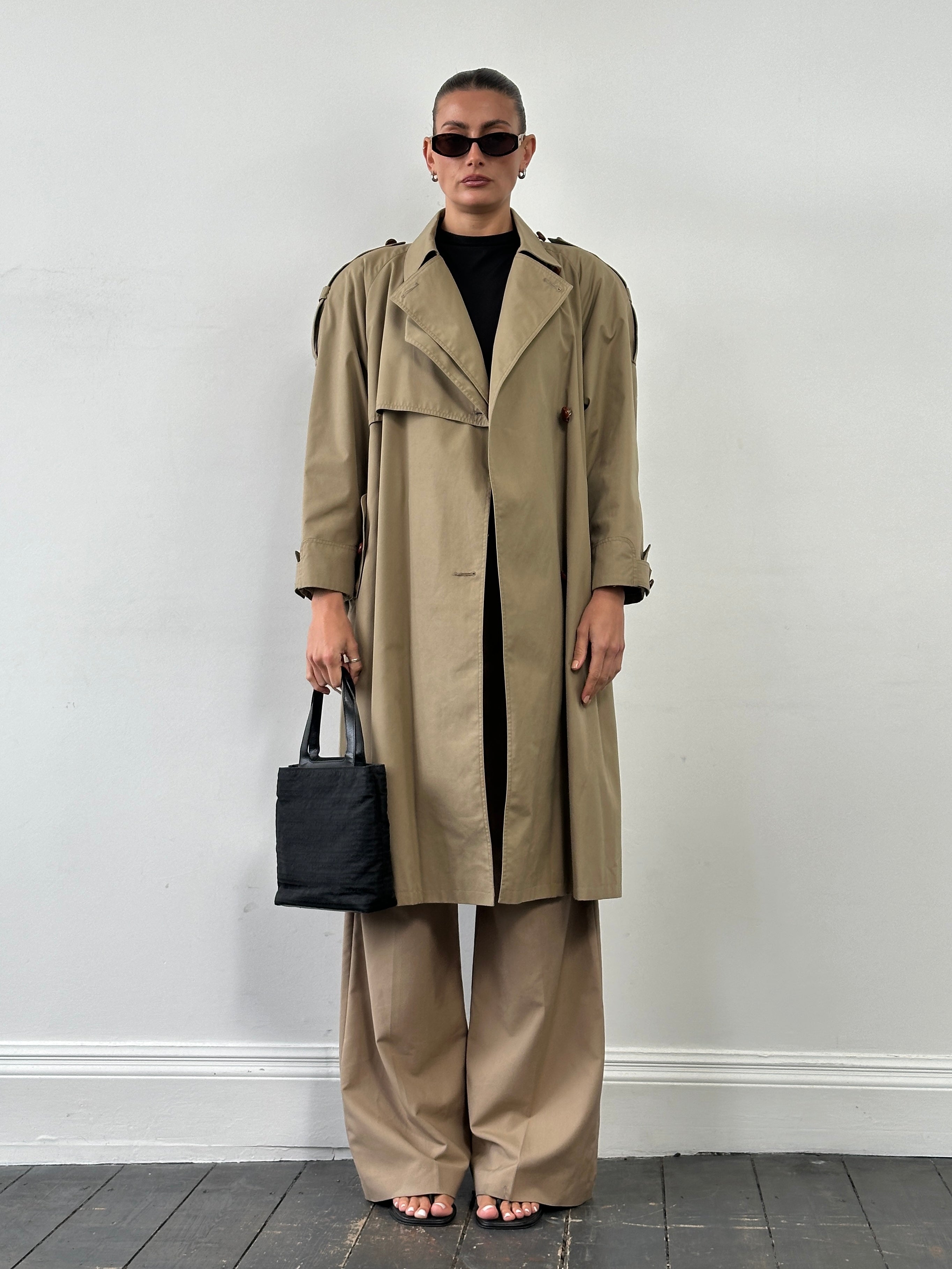 Vintage 1980s Nova Check belted trench coat, medium size, classic style with button details and shoulder epaulets.