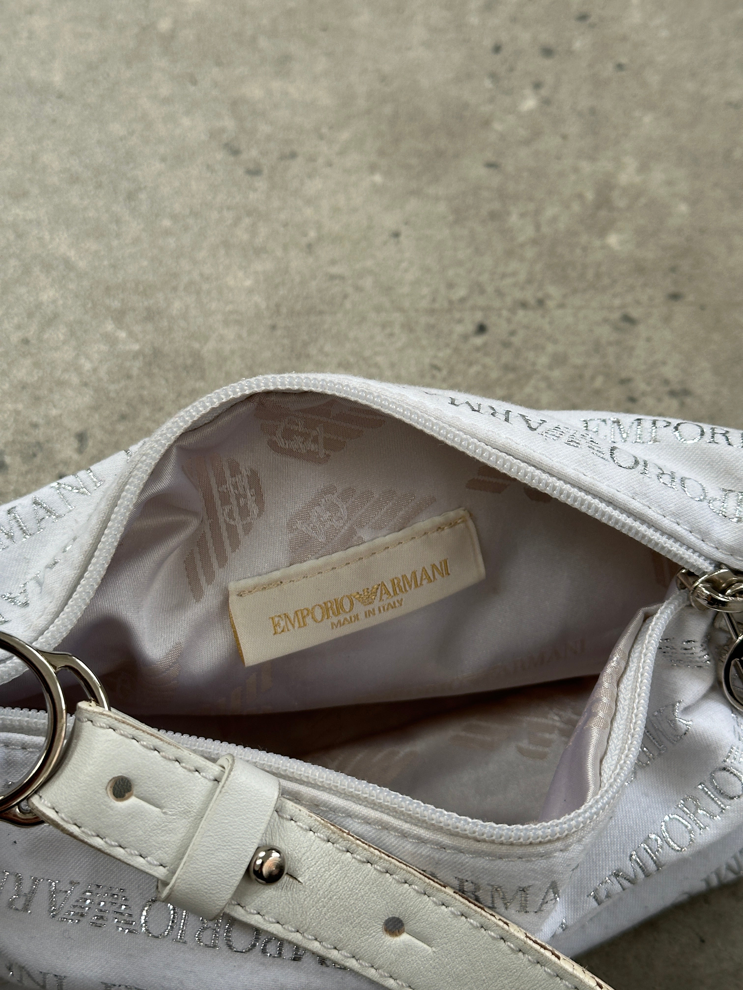Emporio Armani Monogram Shoulder Bag with signature logo and patterned design, featuring a sleek strap and spacious interior.