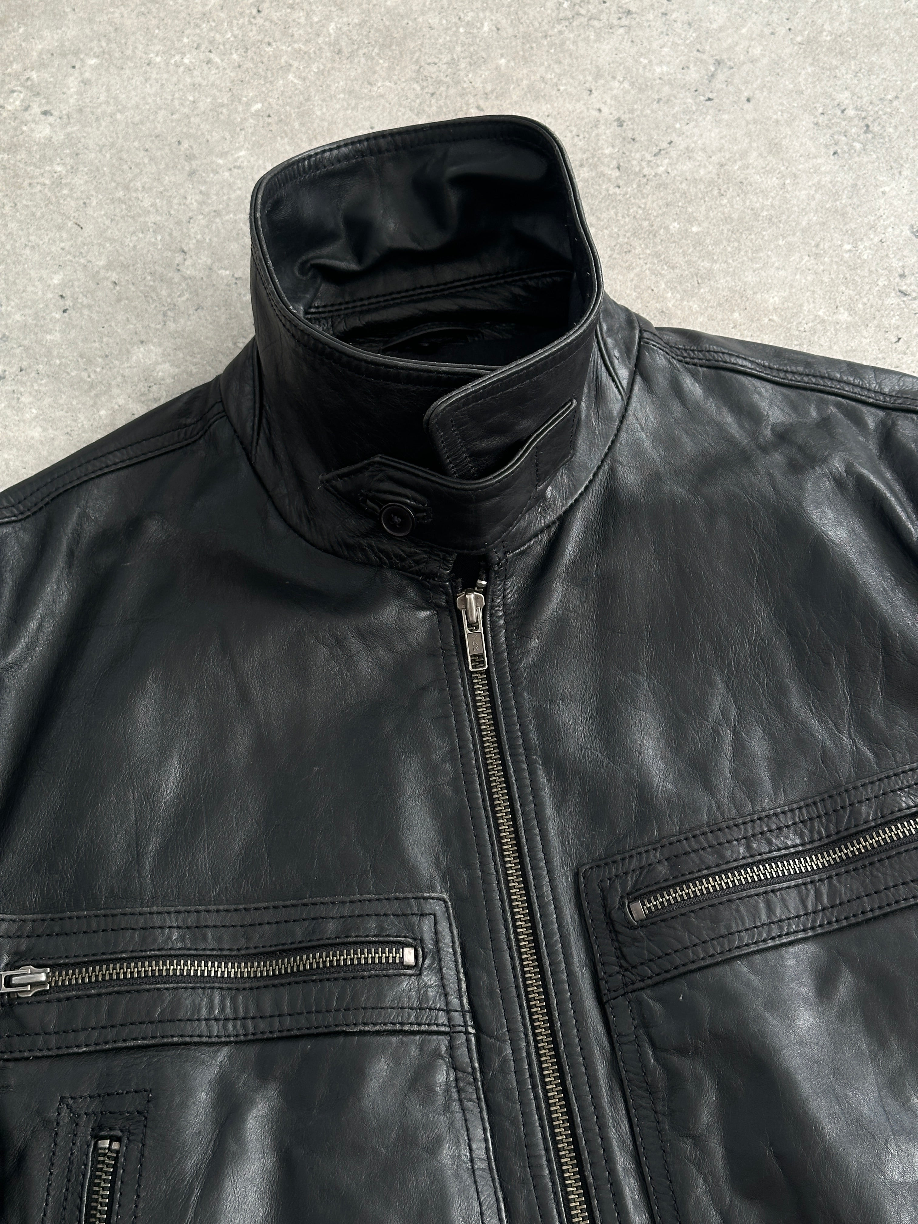 Conbipel high neck leather jacket in size M, showcasing black leather with a sleek high collar and stylish design.