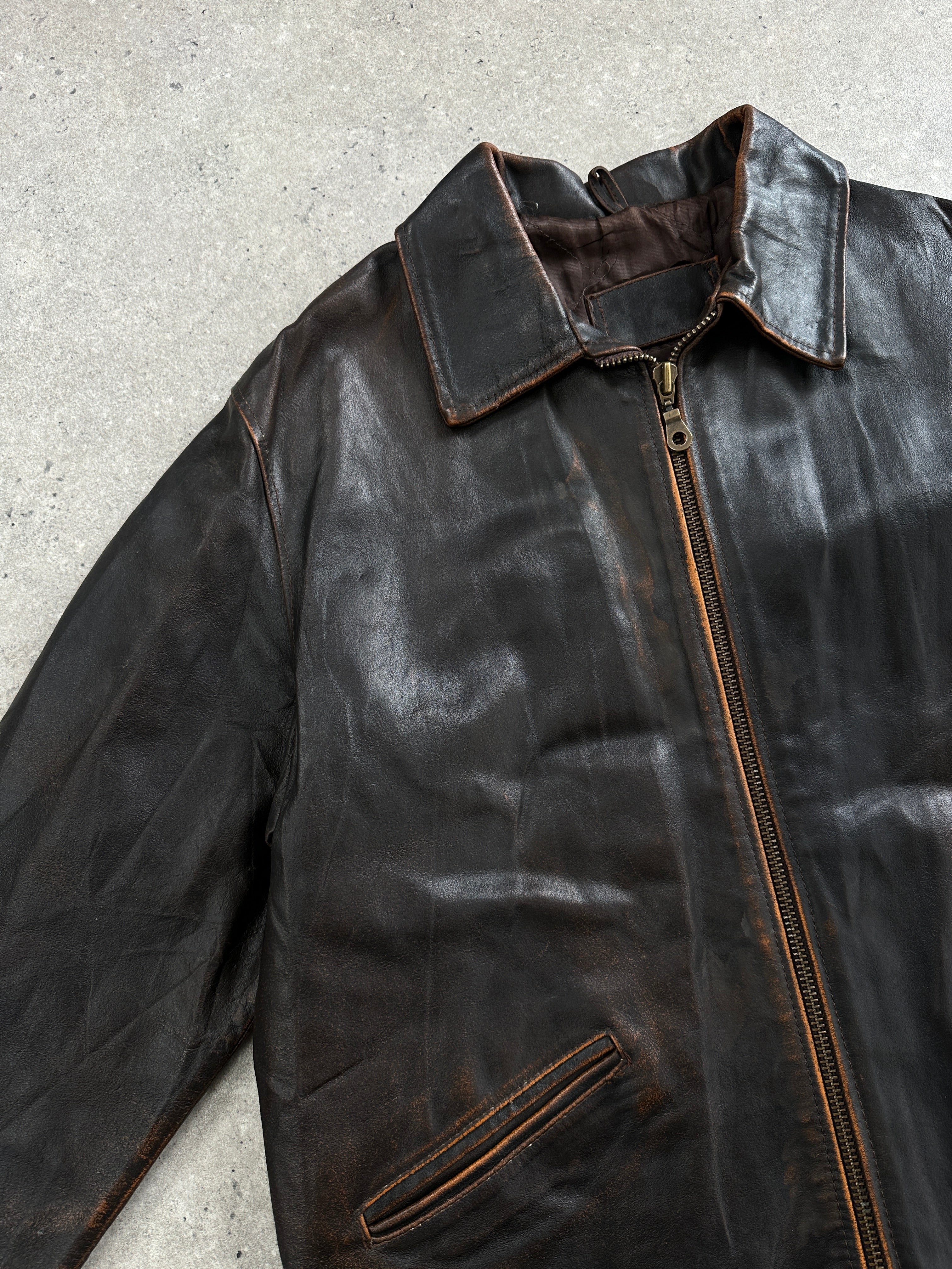 Vintage Italian 1990s distressed leather jacket, size L/XL, featuring worn, rugged leather and classic style.