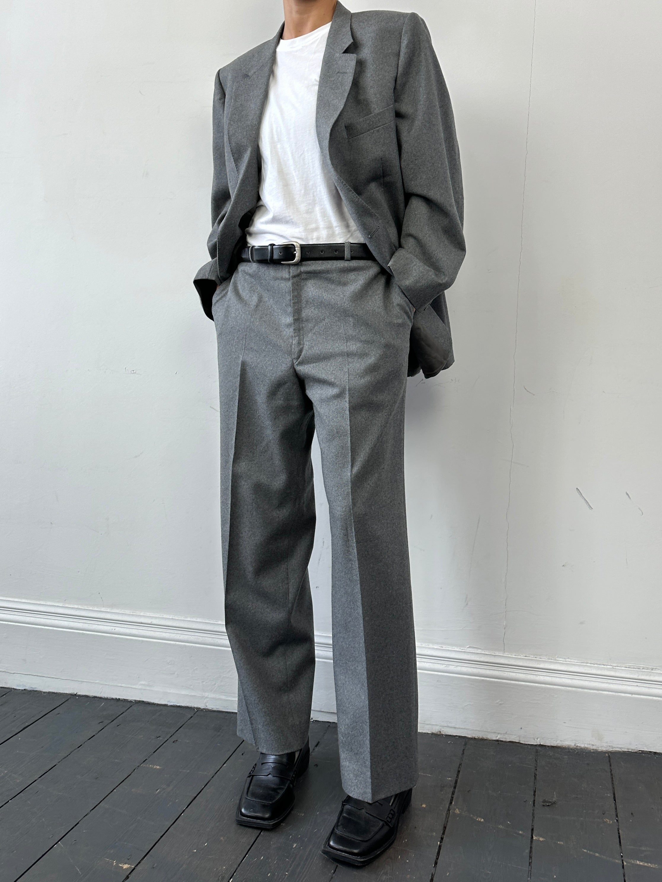 Christian Dior wool single-breasted jumpsuit in size 44R/W32, tailored with a sleek, elegant design and classic fit.