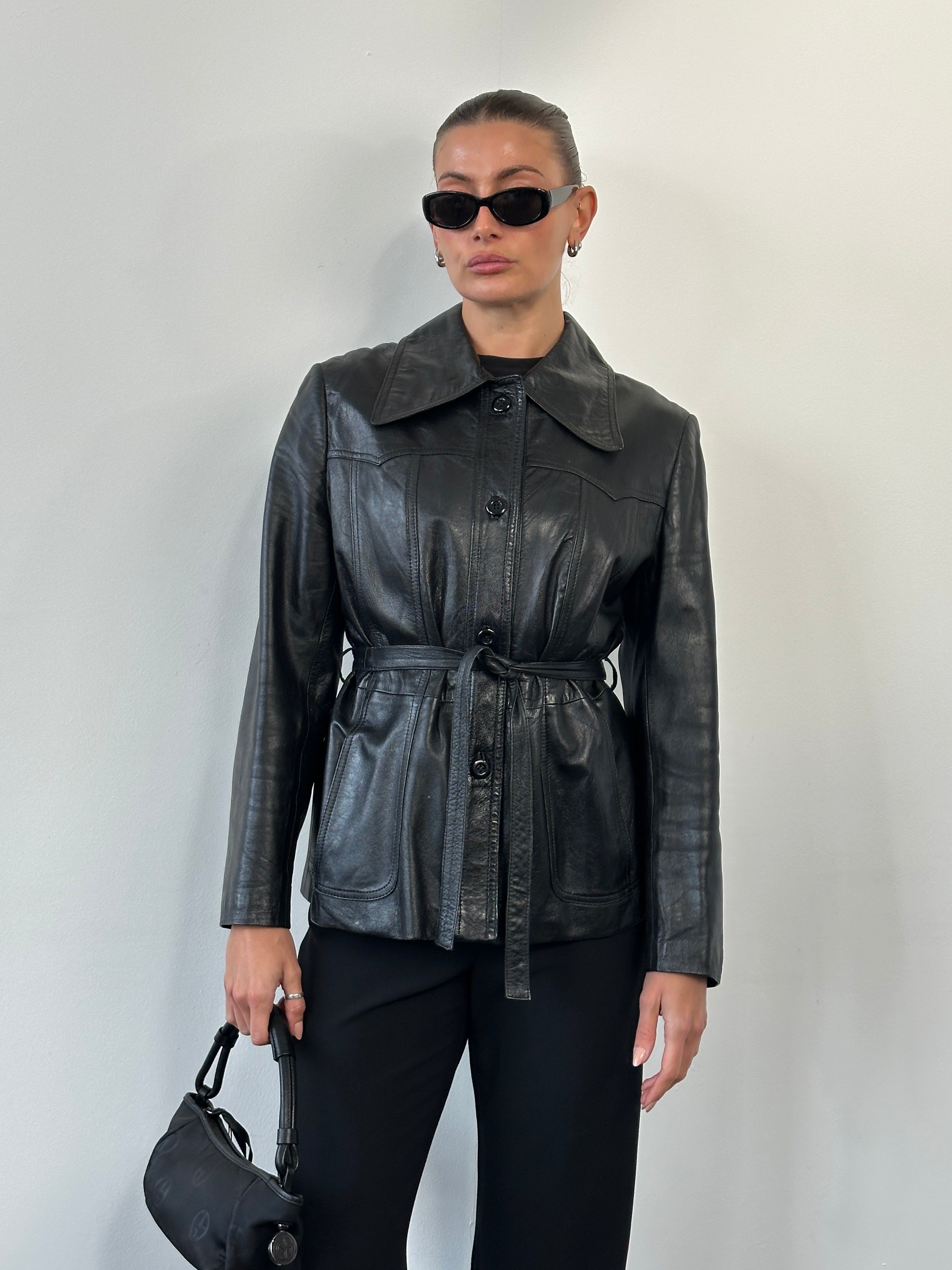 Vintage 1990s leather jacket with dagger collar and belt, size M, featuring classic distressed leather and retro style details.
