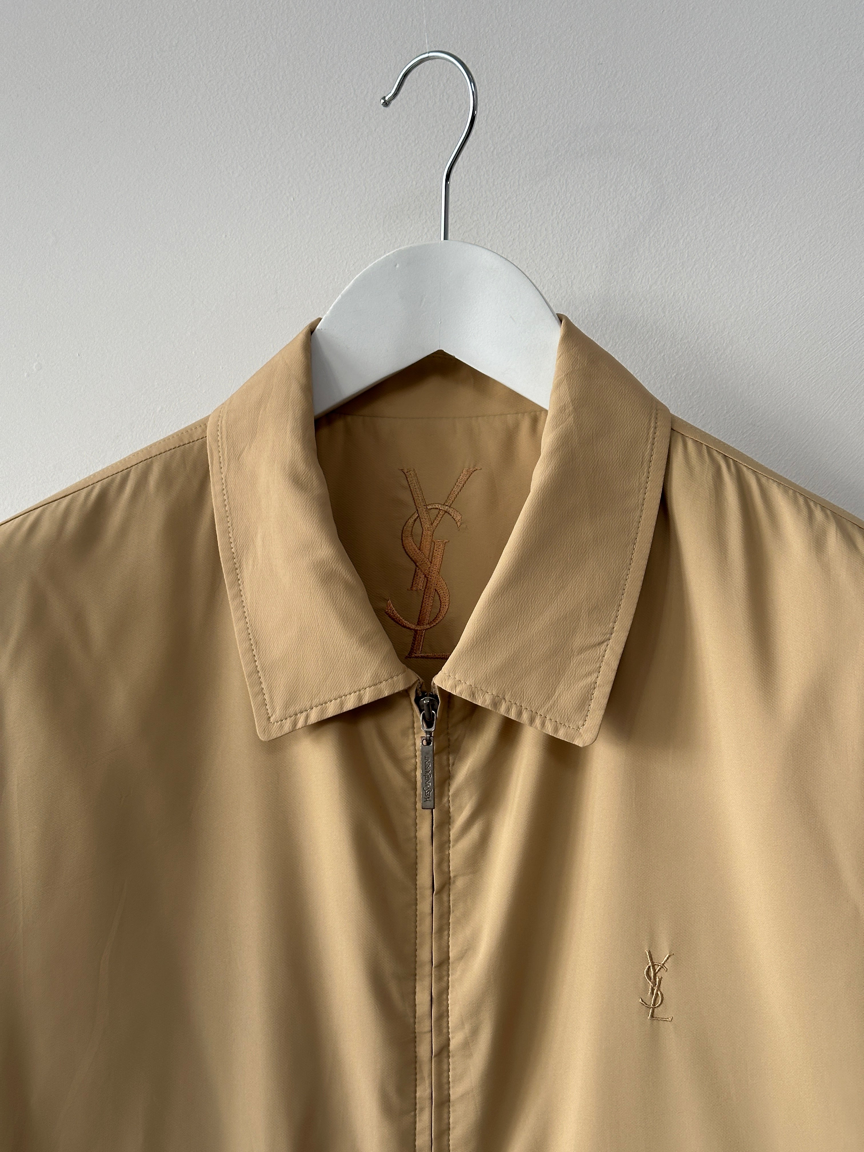 Yves Saint Laurent Pour Homme logo bomber jacket in size large, navy blue with YSL branding and ribbed cuffs and collar.