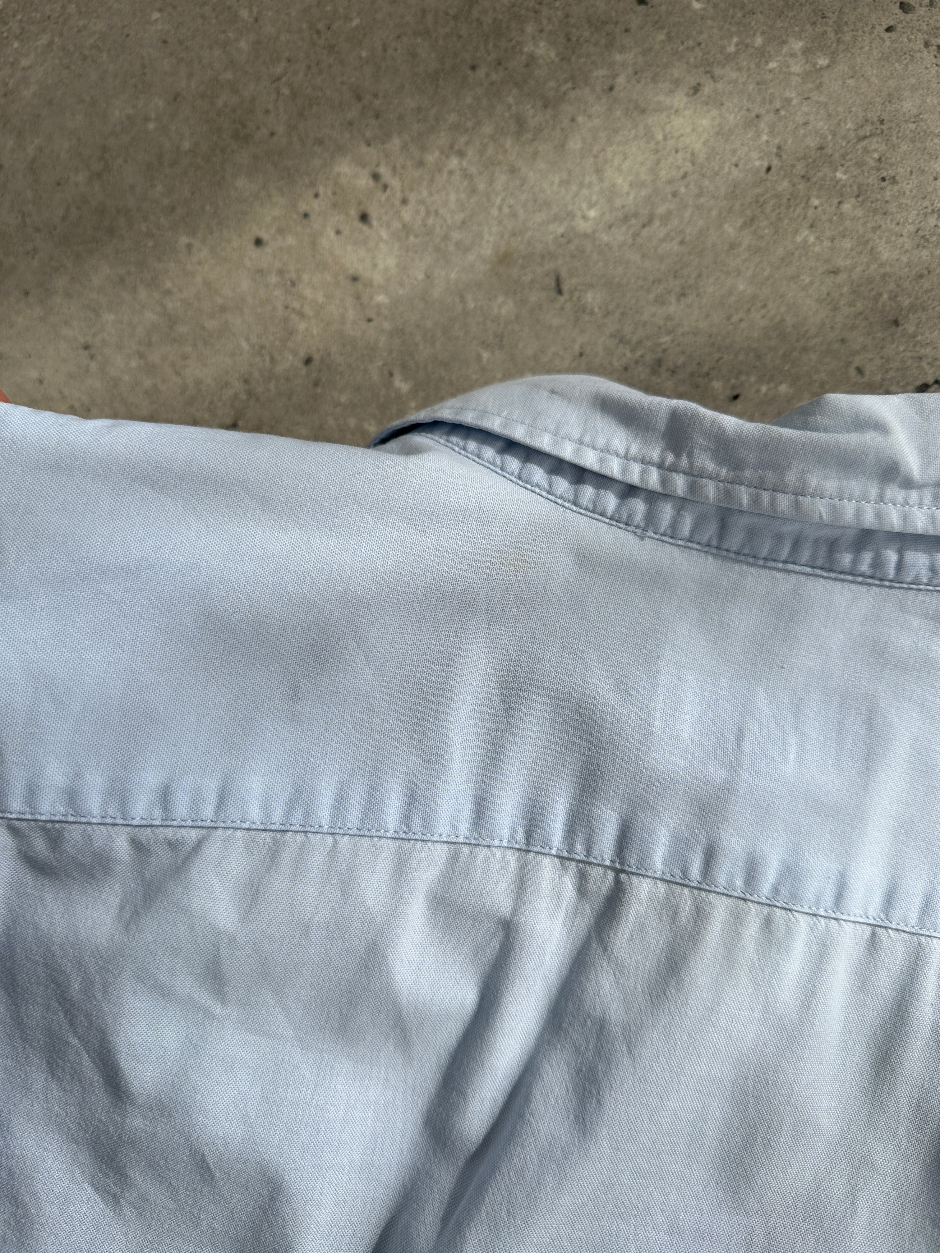 Armani Jeans pure cotton logo shirt in size L, featuring a classic design with the Armani logo on the front.