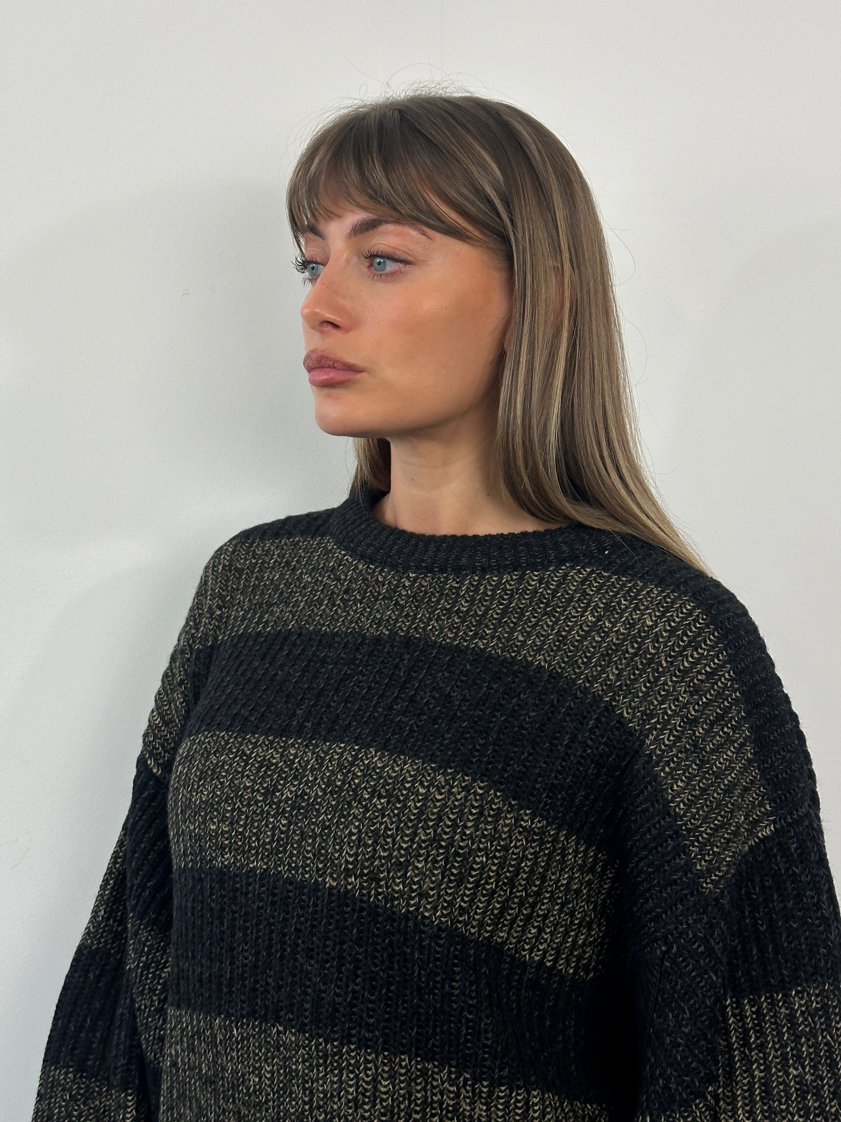 Vintage 1990s Italian wool and alpaca striped knitted jumper in XL/XXL, featuring cozy, multicolored knit pattern.