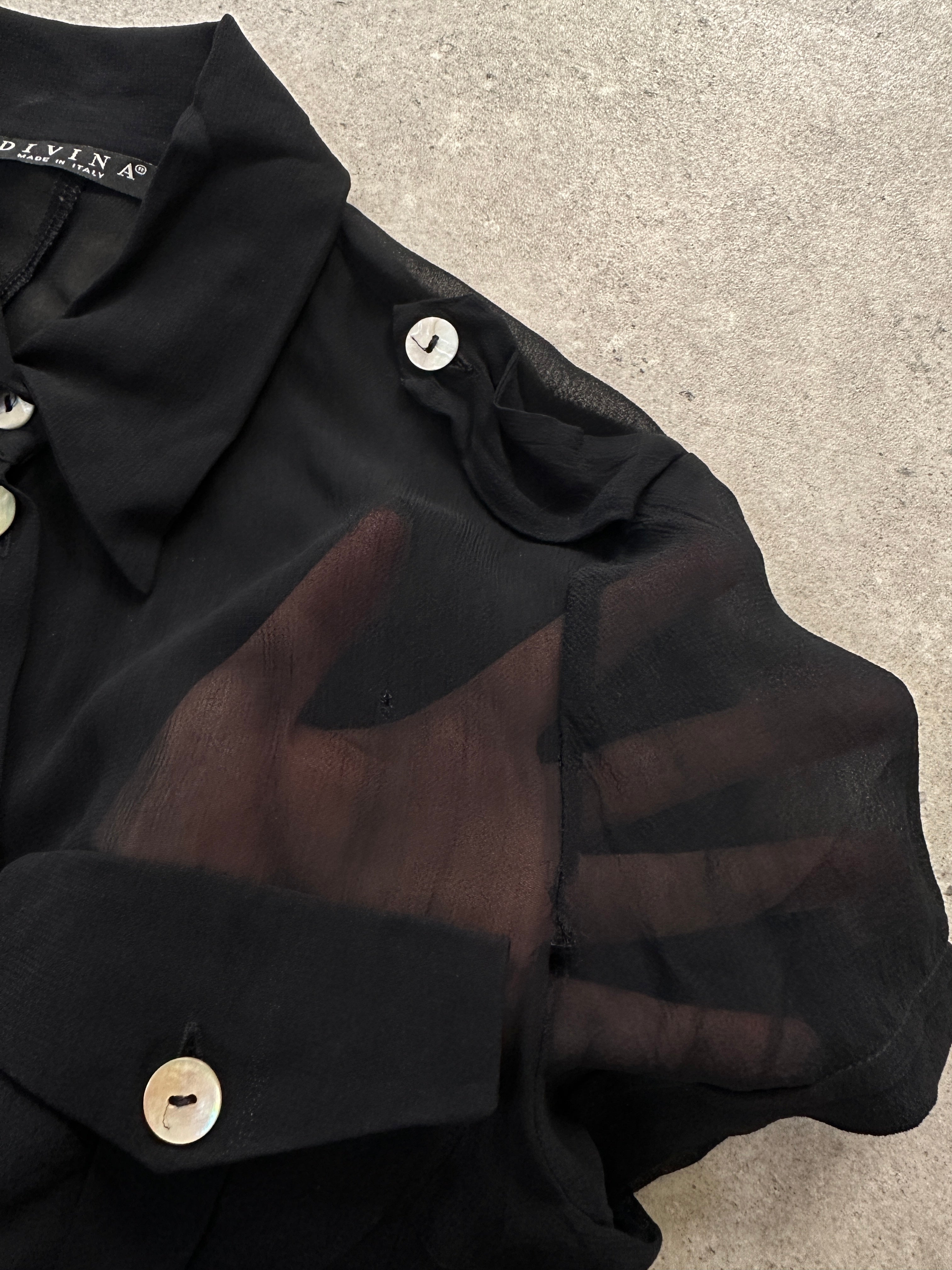 Light Italian vintage sheer short sleeve shirt with delicate fabric and subtle design, perfect for casual or stylish wear.