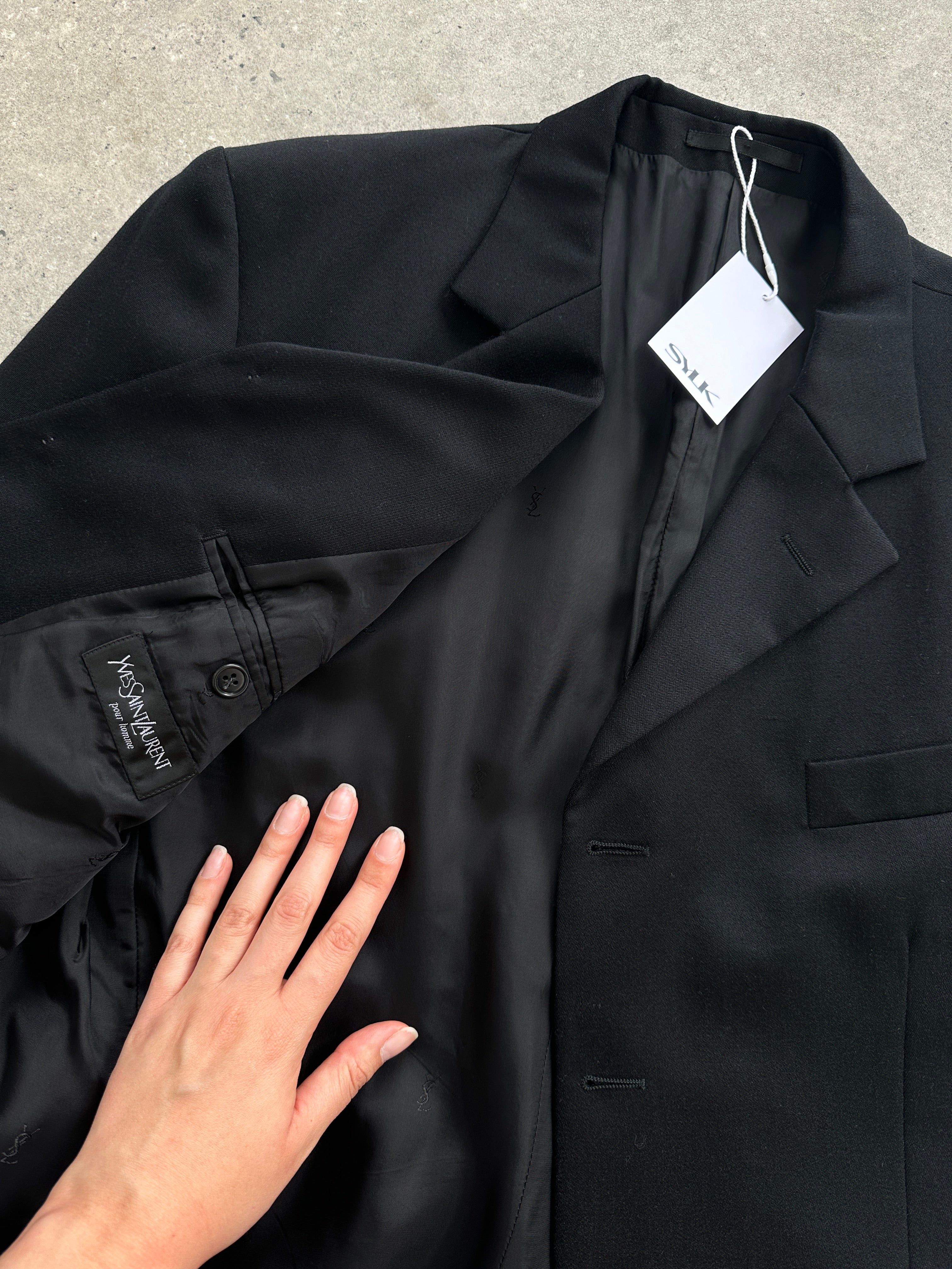 Yves Saint Laurent men's pure wool blazer in size 44L/XL-XXL, single-breasted with notch lapel, in dark navy fabric.