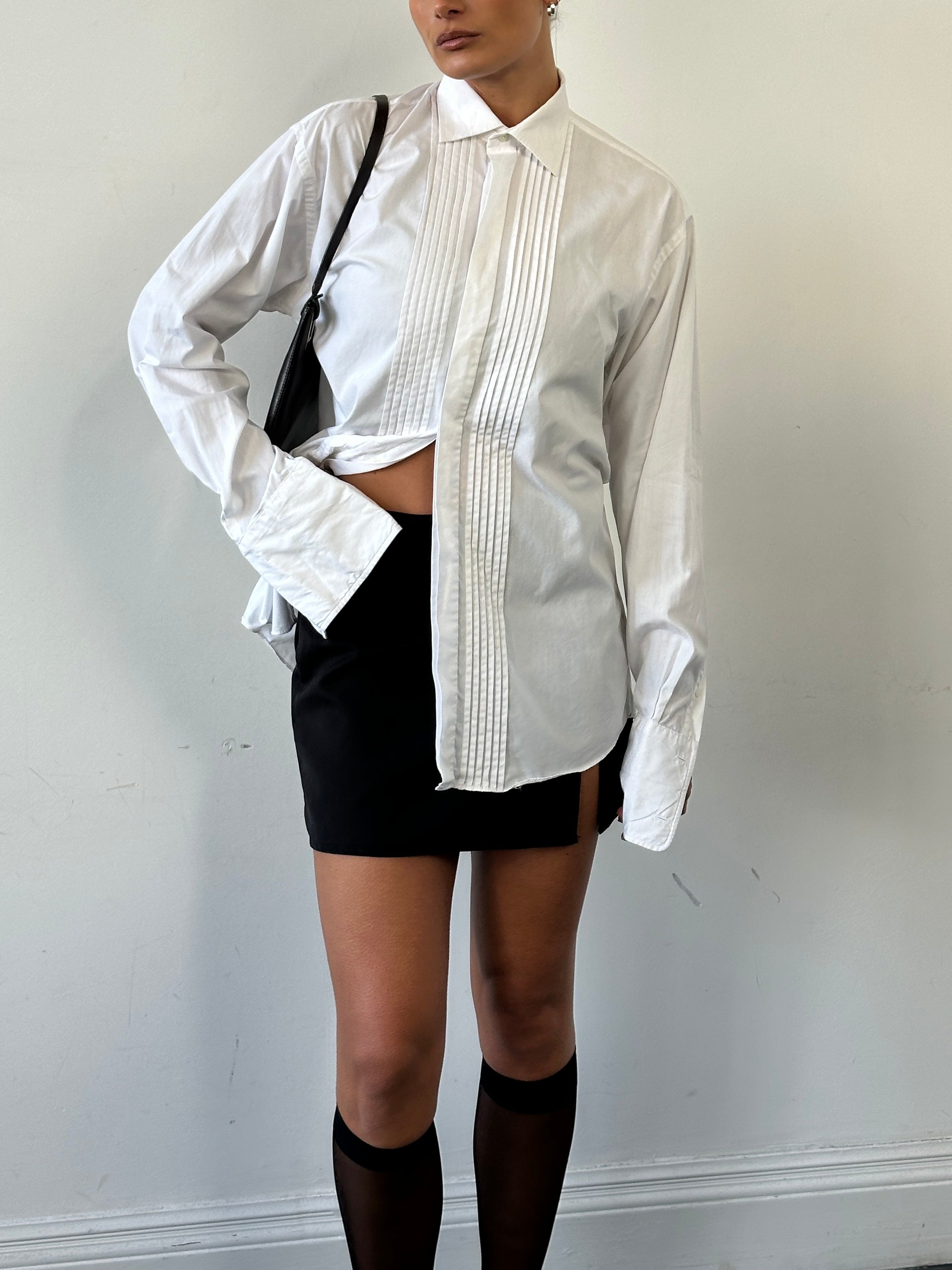 Christian Dior tuxedo pleated dress shirt in white with a classic collar and button front, available in size M/L.