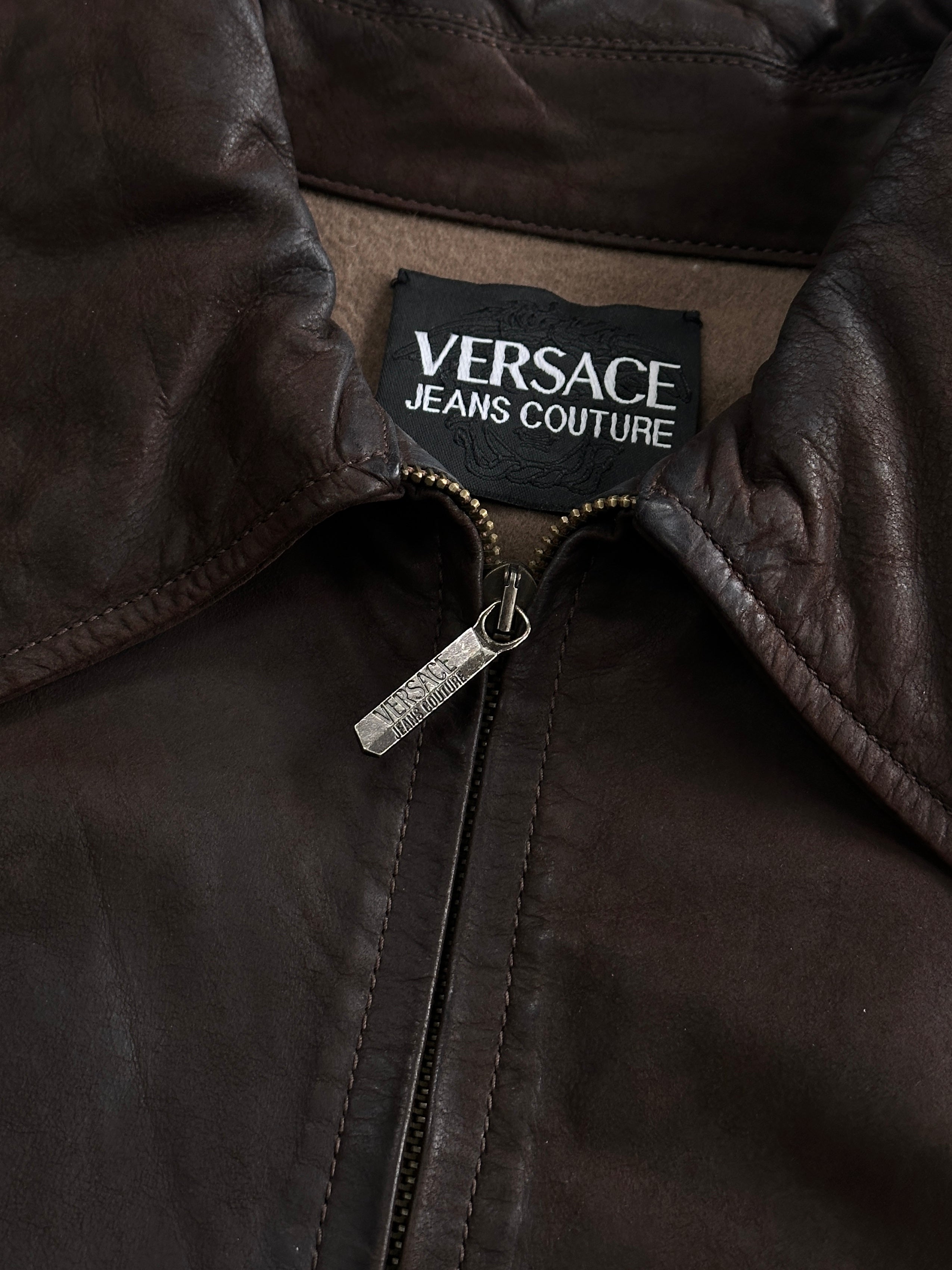 Versace Jeans Couture 1990s boxy leather jacket in black, featuring a classic design with silver hardware and structured fit.