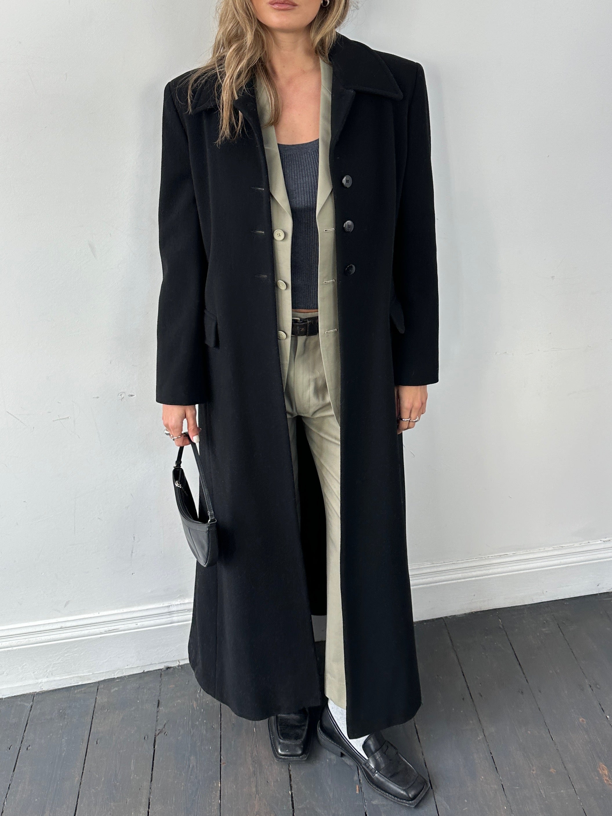 Vintage wool single-breasted A-line coat in size S, showcasing classic design with a tailored fit and textured fabric.