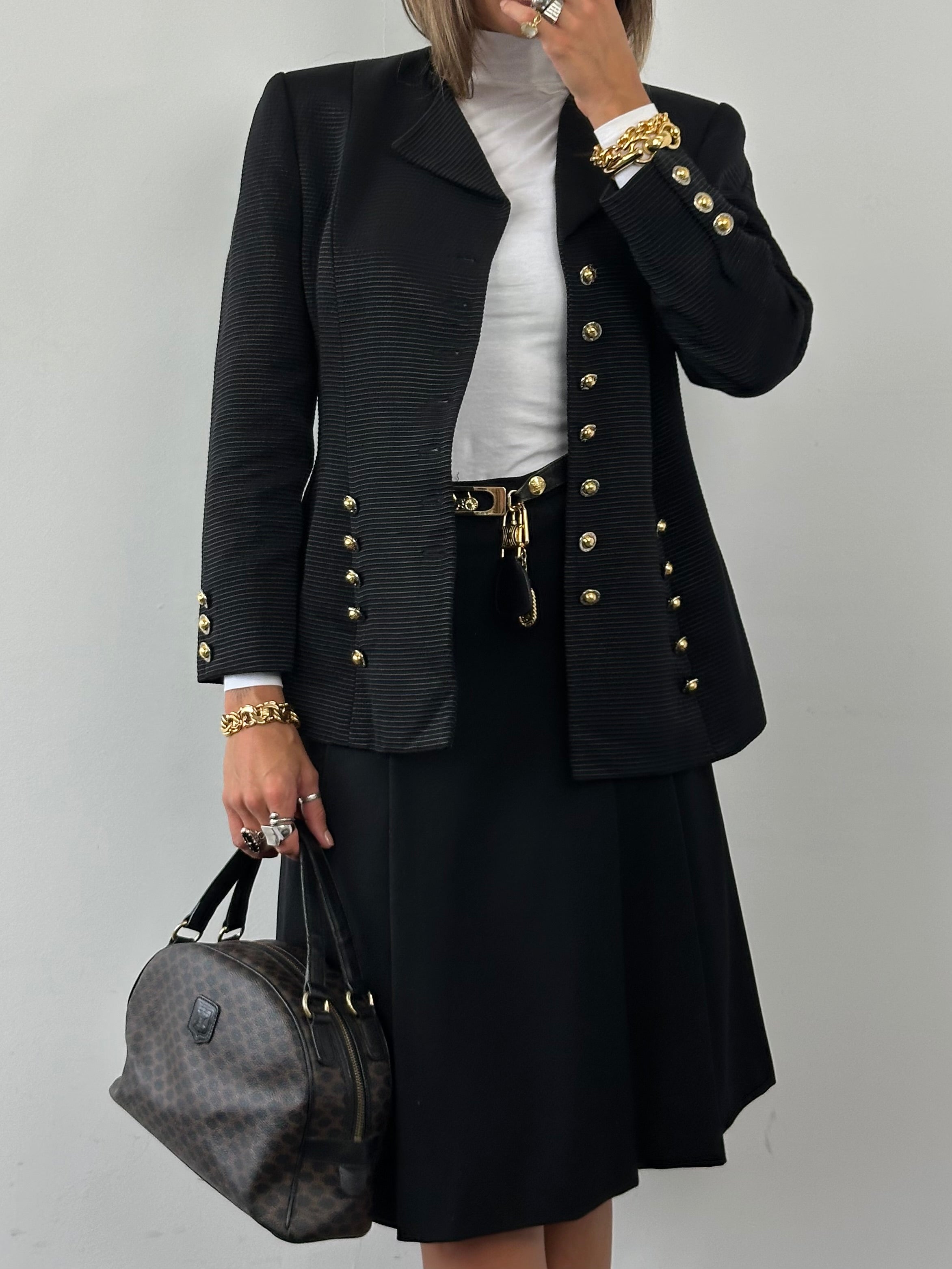 Celine 1980s pure wool logo hardware pleated skirt in W24, featuring a high waist and vintage pleated design.
