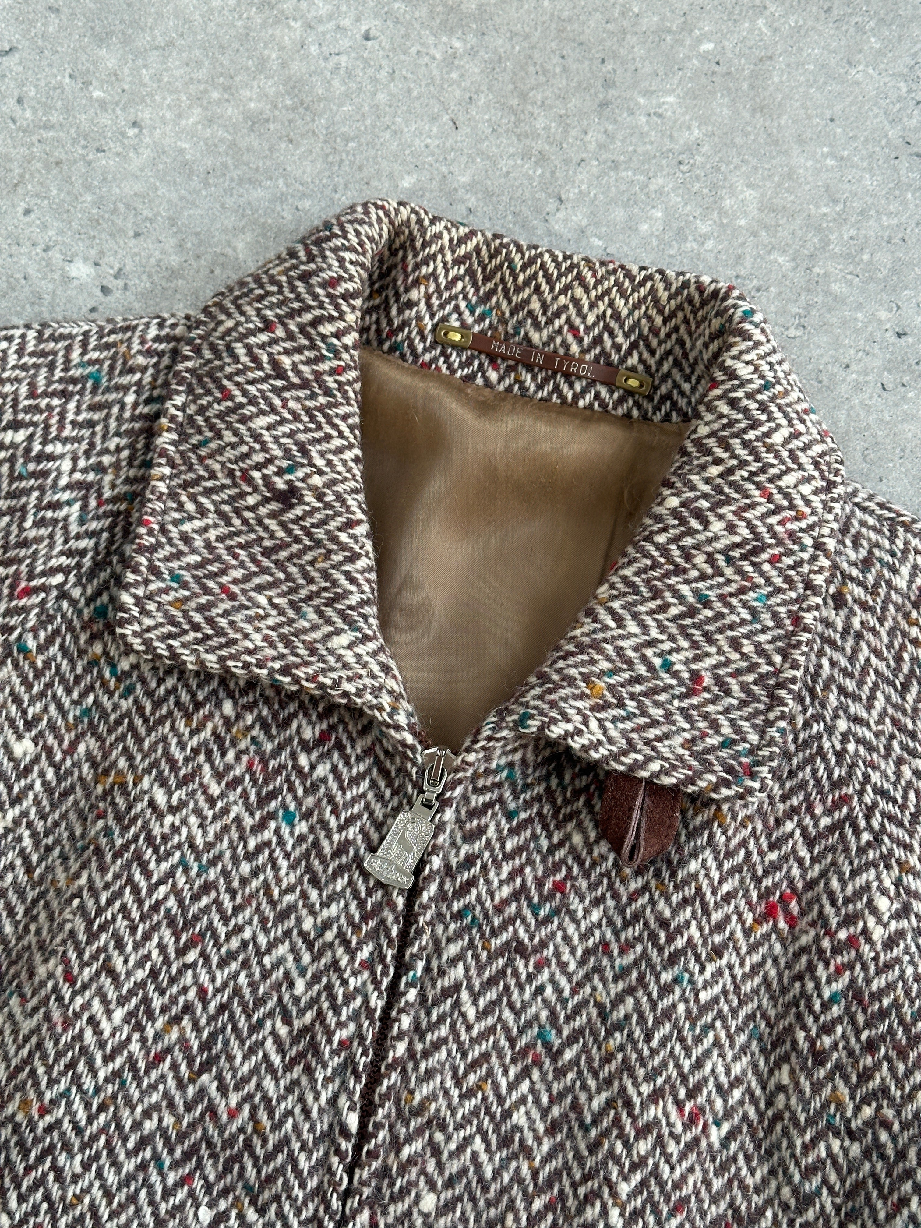 Vintage pure wool herringbone bomber jacket in size L, featuring classic design and textured fabric.