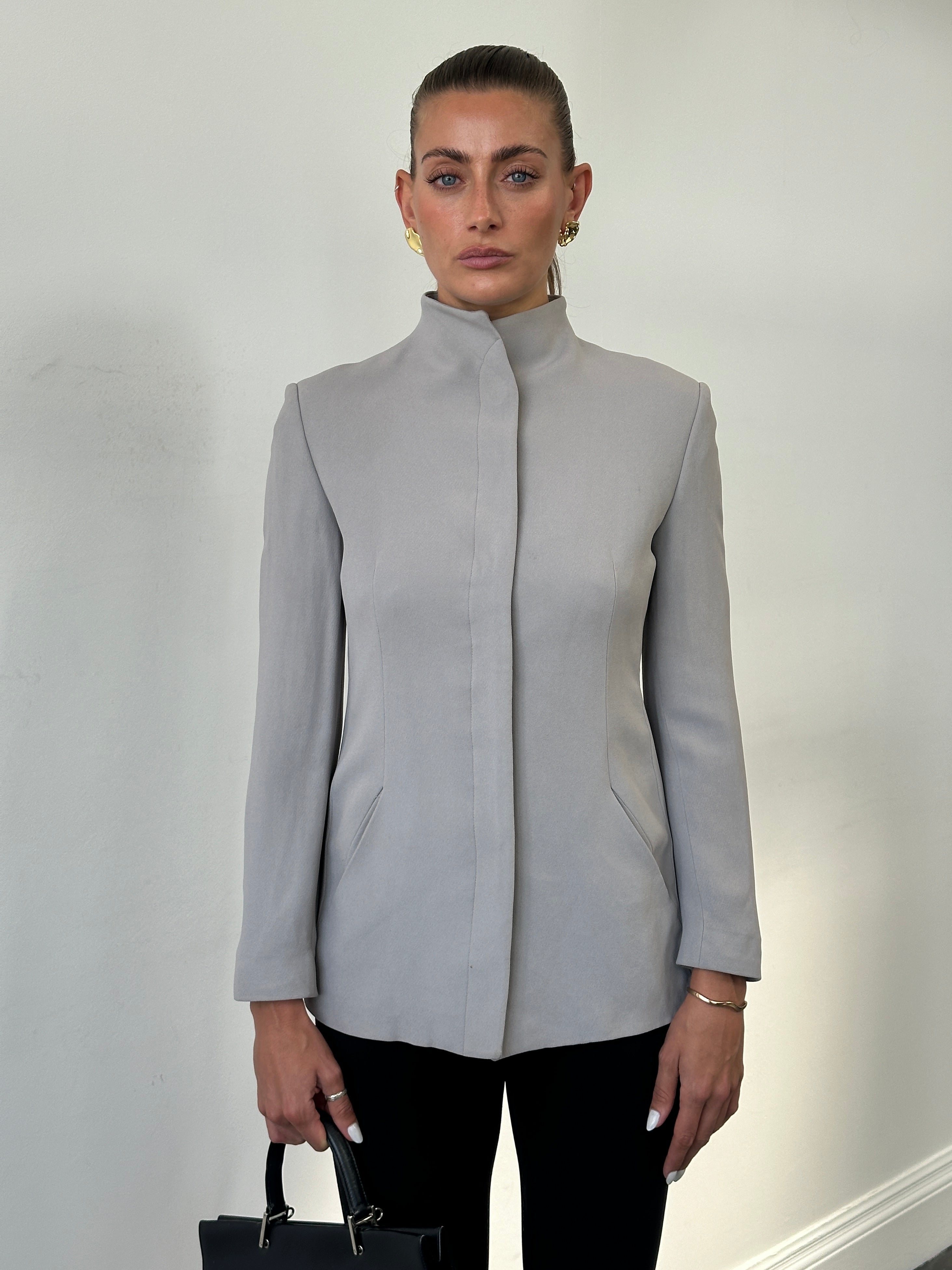 Emporio Armani high neck fitted blazer jacket in black, showcasing sleek minimal design and tailored silhouette.