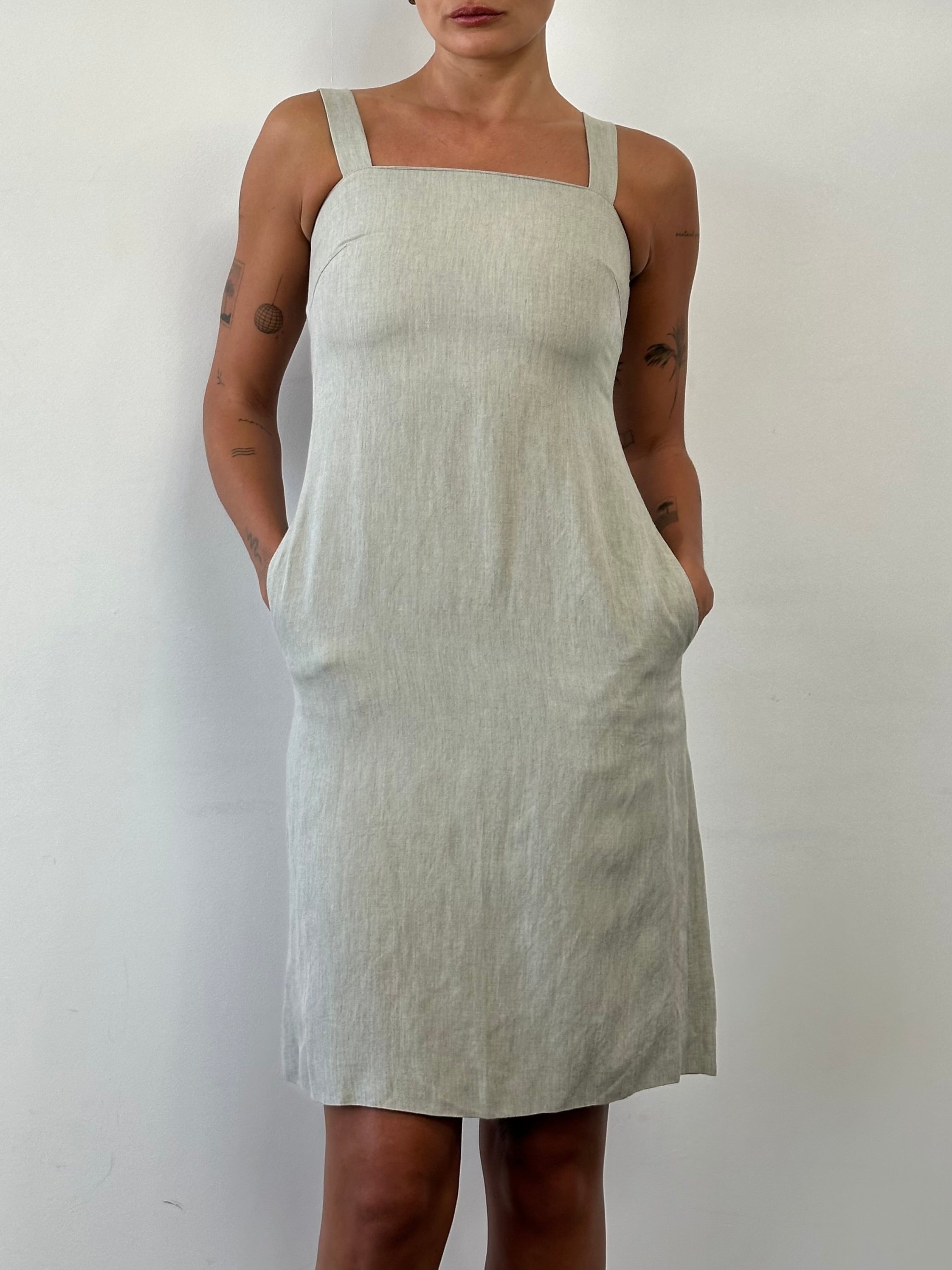 Marella linen midi dress in XS/S, featuring a relaxed fit and natural linen fabric, displayed on a hanger against a neutral background.