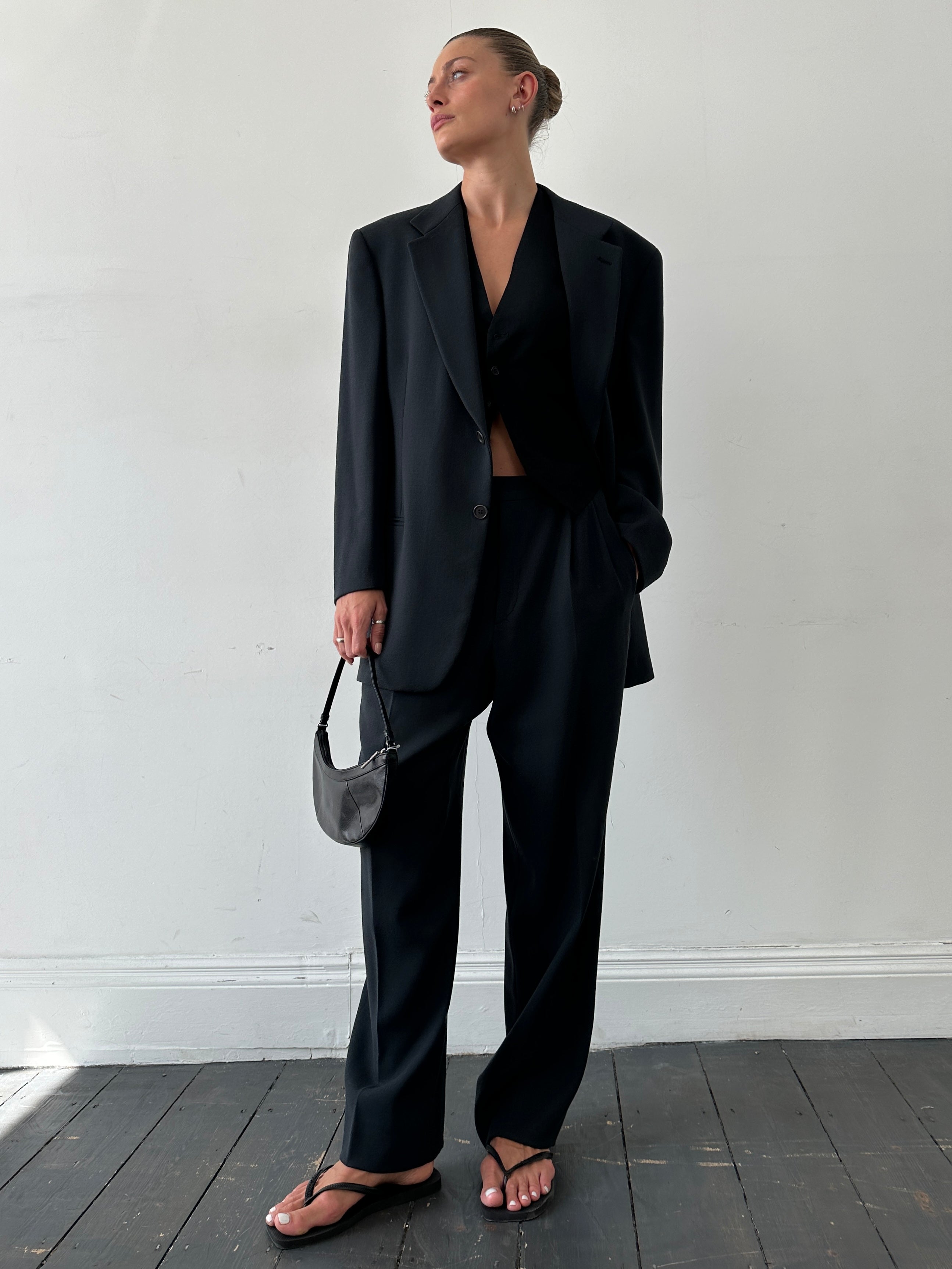 Emporio Armani single-breasted wool jumpsuit in size 40R/W32, tailored fit with classic lapel collar and sleek design.
