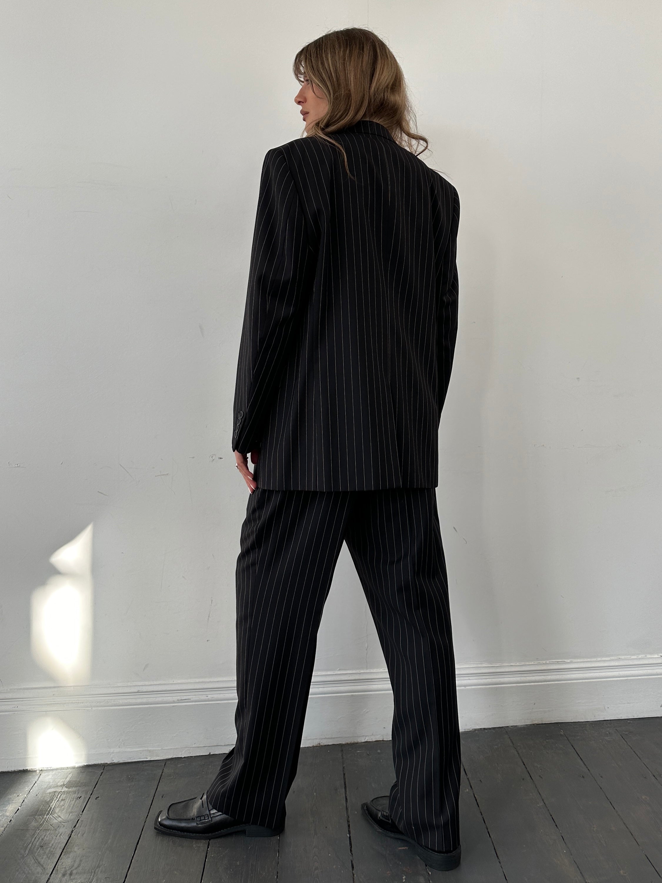 Yves Saint Laurent pinstripe wool jumpsuit in size 40S/W34, featuring tailored fit and classic pinstripe pattern.