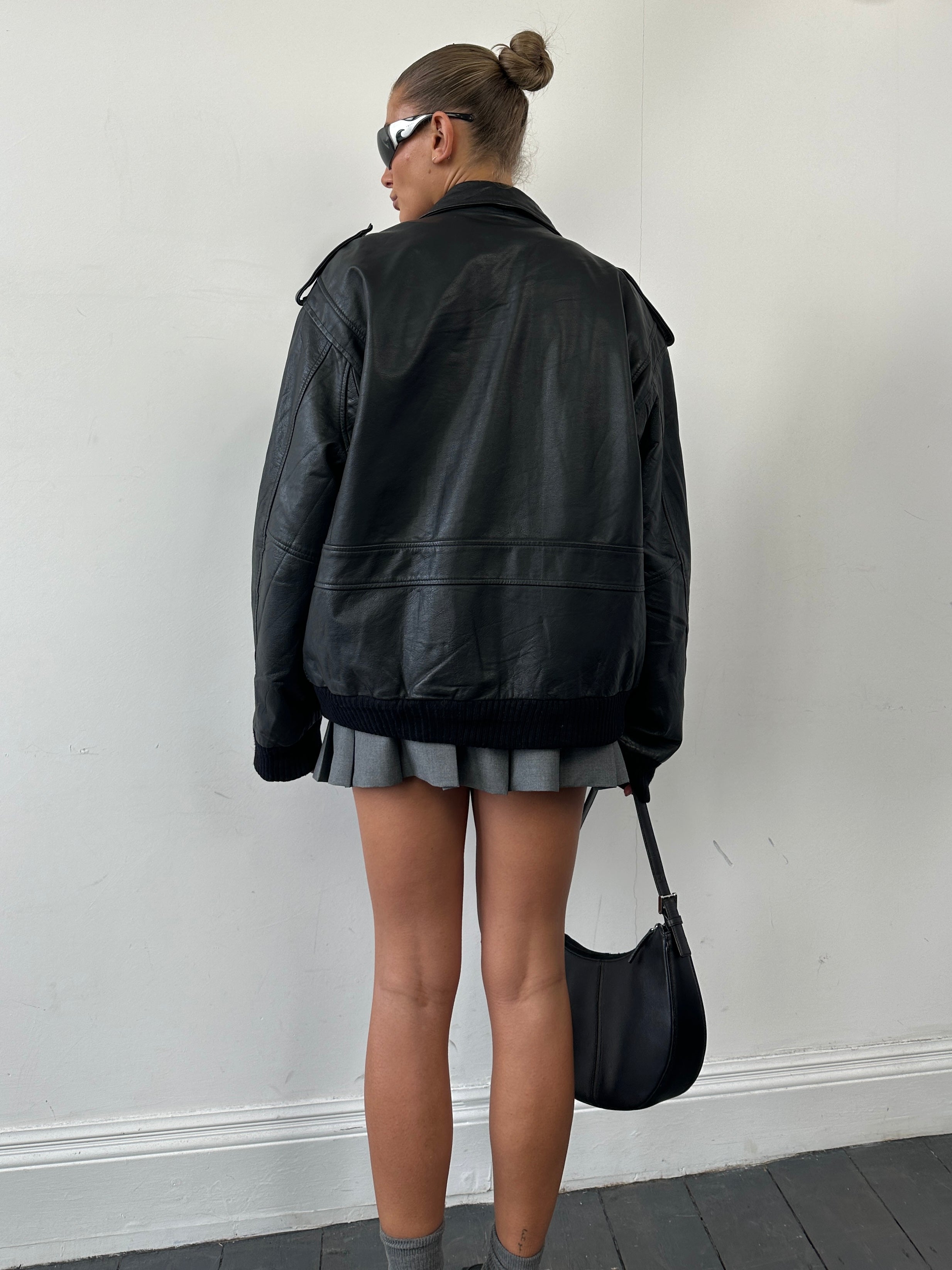 Conbipel removable fleece-lined aviator leather bomber jacket in size L/XL with classic design and quilted details.