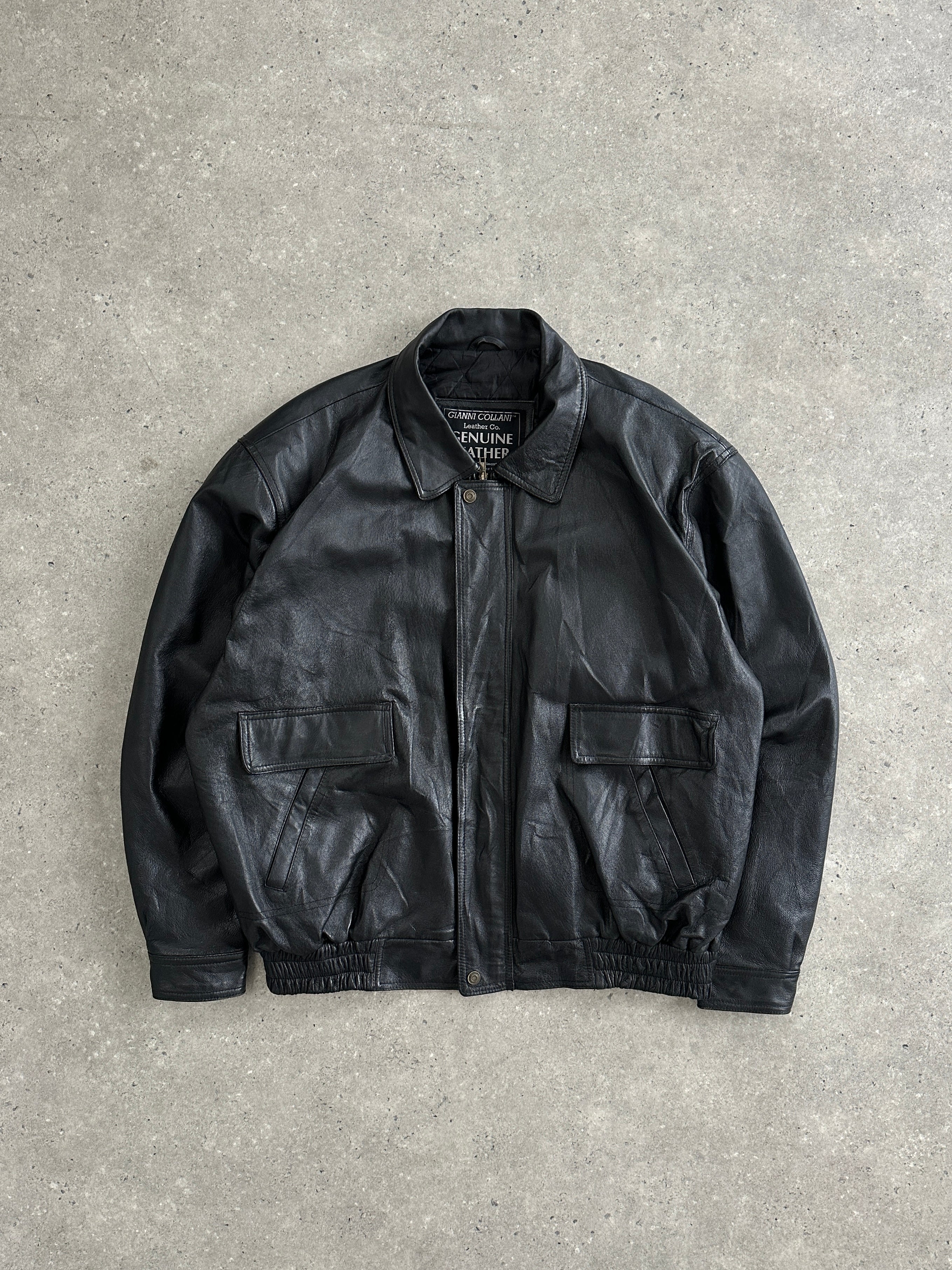 Vintage brand vintage leather bomber jacket in XL size, featuring a classic design with a sleek leather finish and ribbed cuffs.
