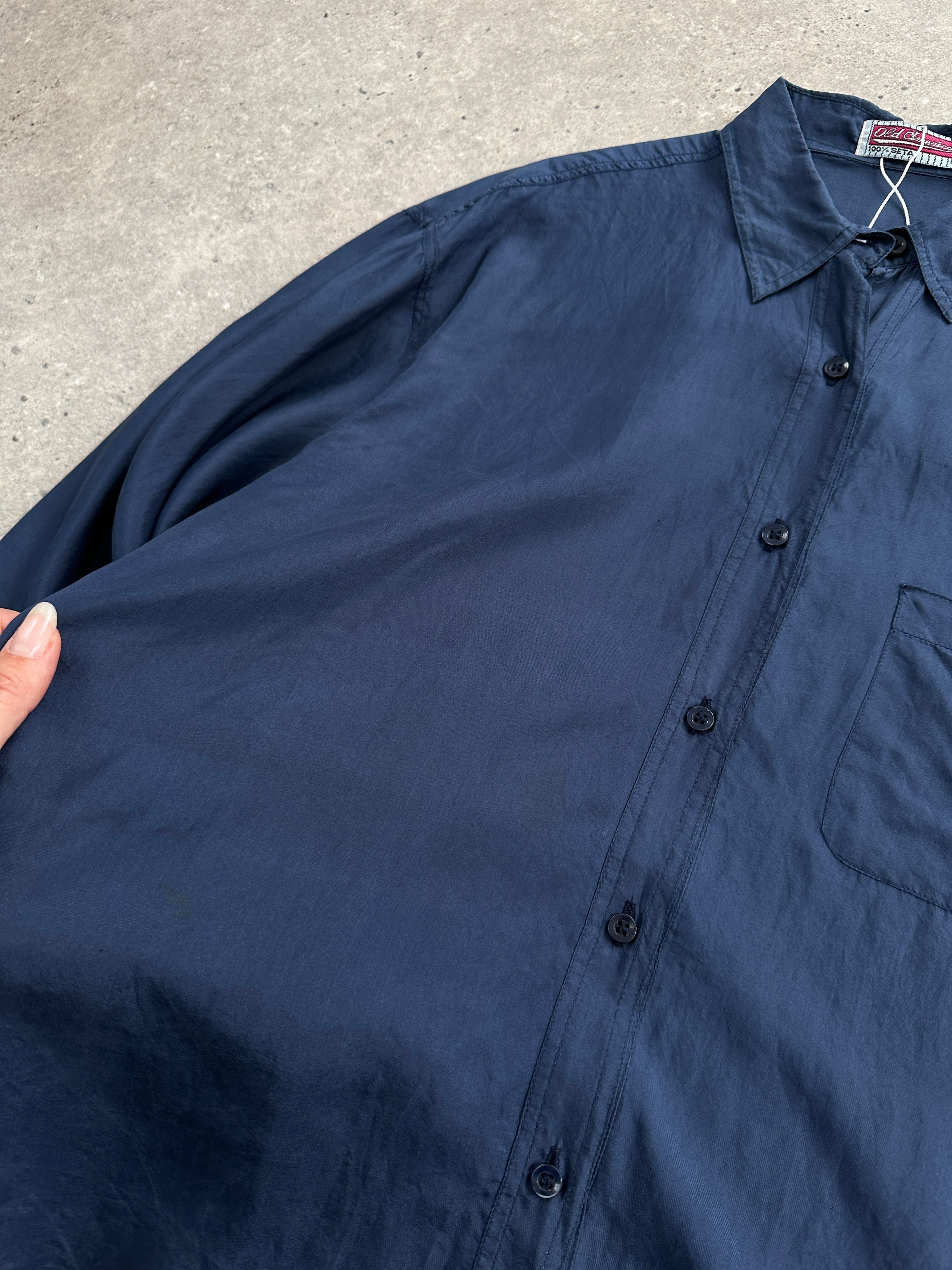 Vintage relaxed pure silk shirt in XL, featuring a classic fit and smooth silk fabric, displayed on a hanger.