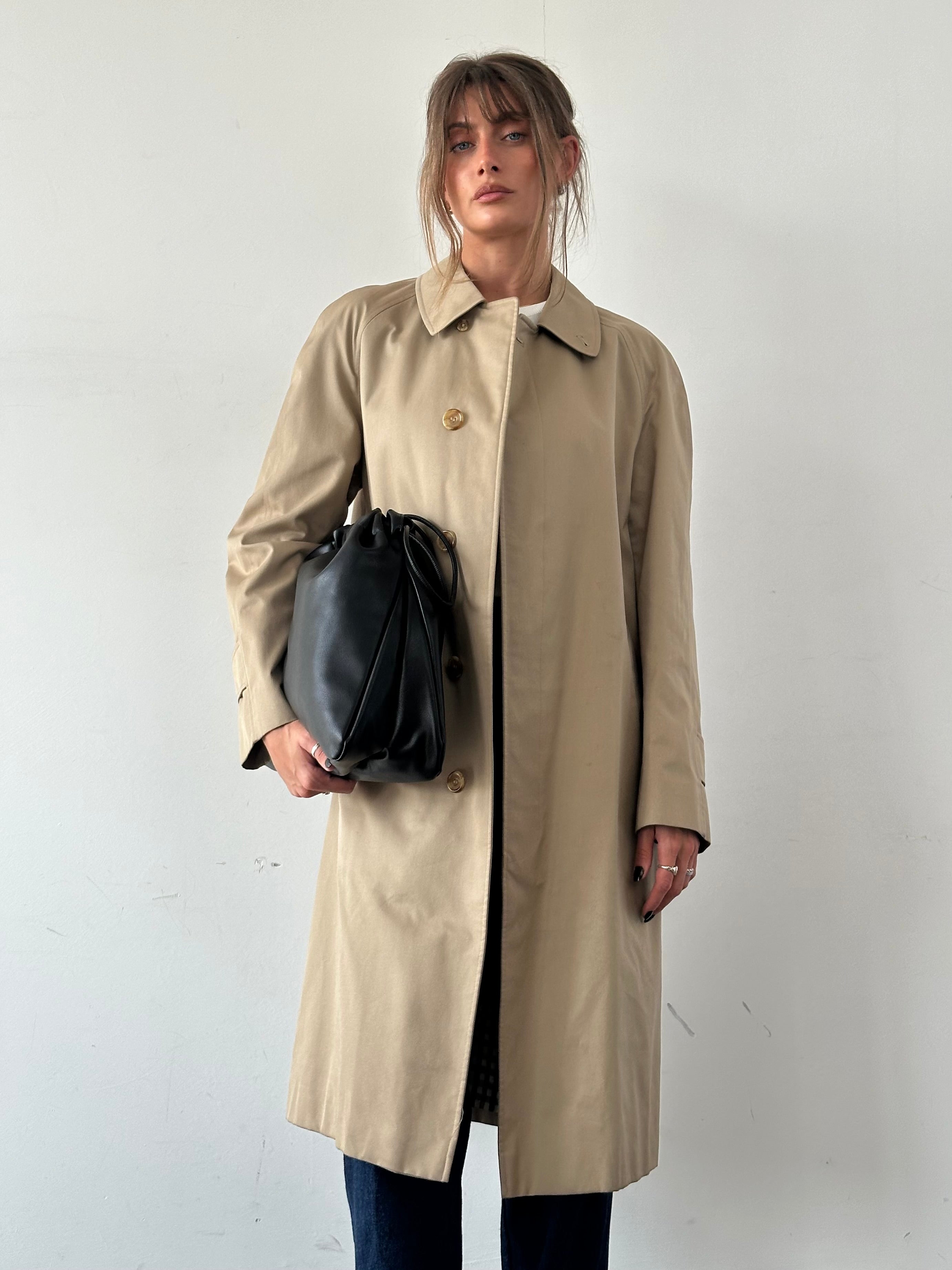 Aquascutum cotton trench coat with concealed placket in XL size, classic beige color, tailored fit, and durable fabric.