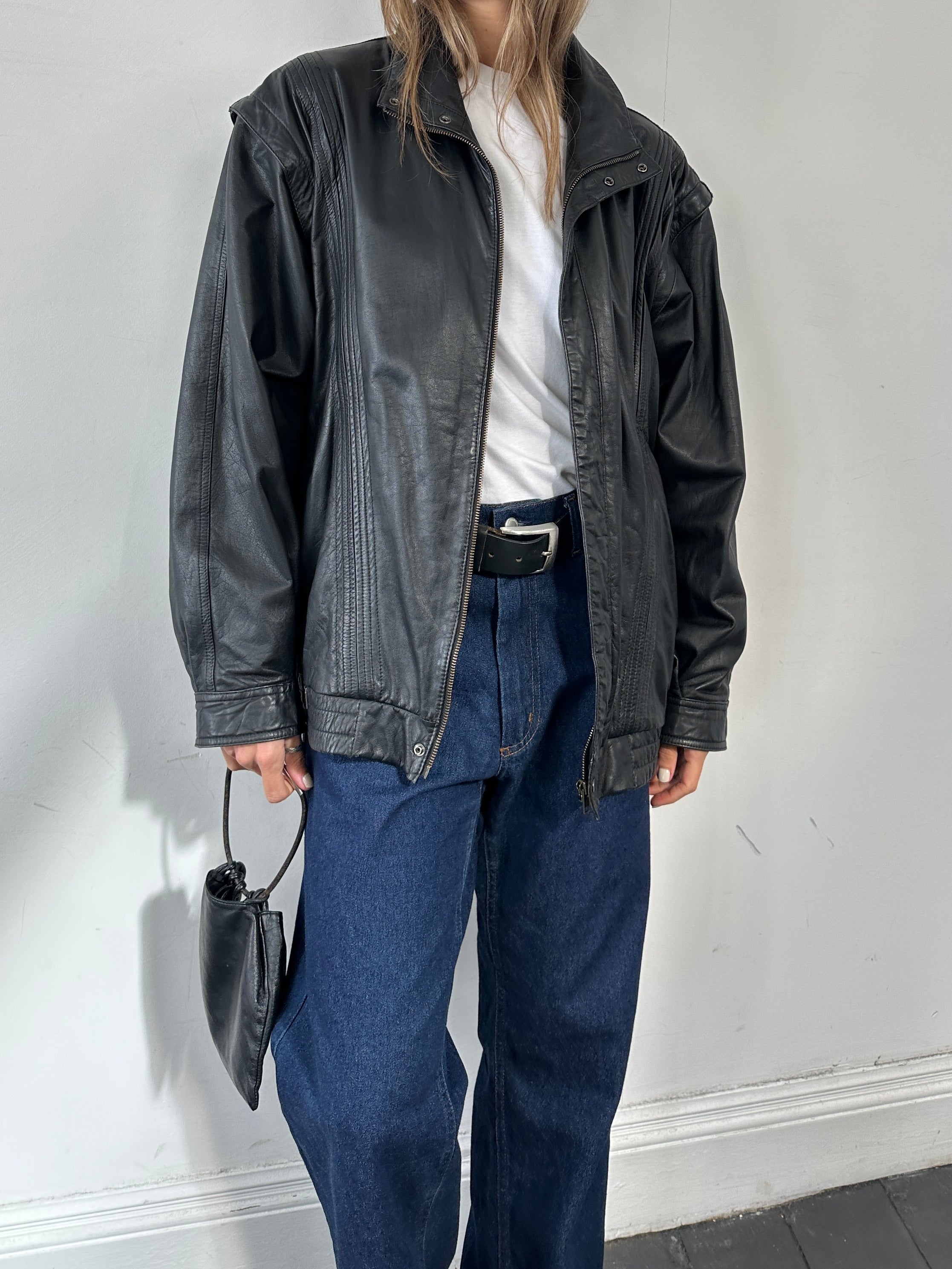 Vintage leather bomber gilet jacket in size XL, featuring classic design and sturdy leather construction.