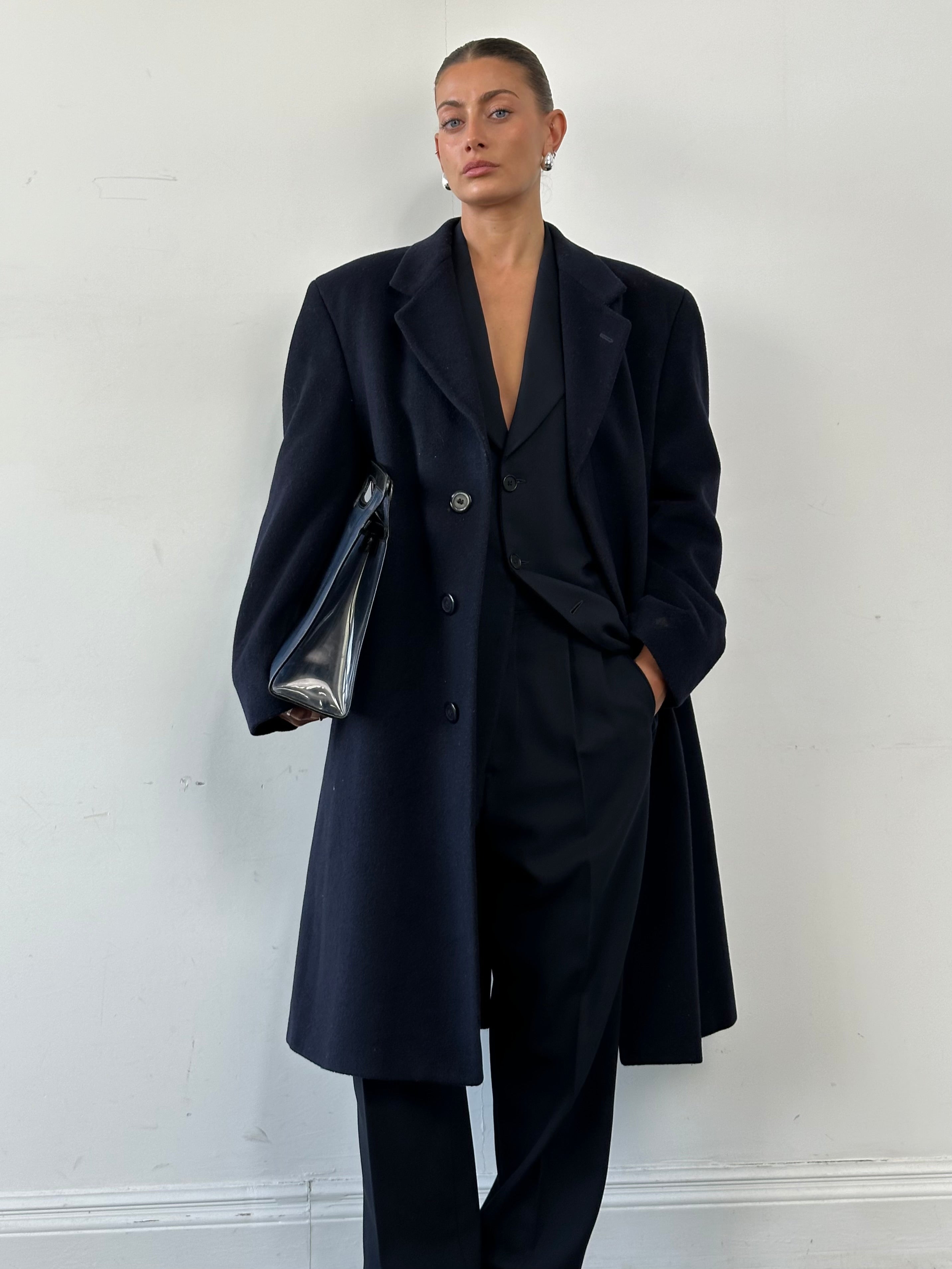 Vintage British wool and cashmere coat with concealed placket in size 42R/XL, classic and warm outerwear for cold weather.