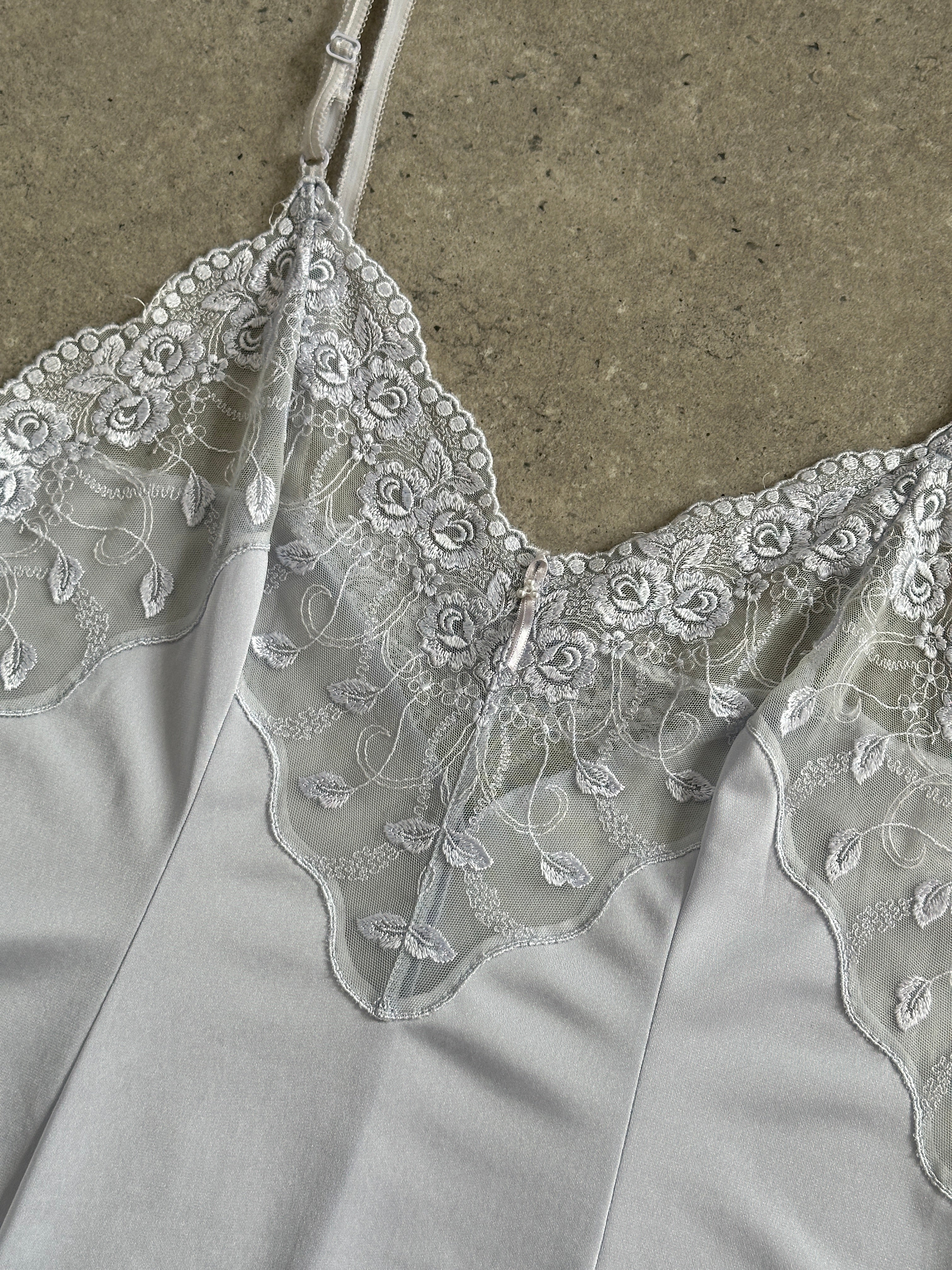 Vintage 1990s lace sheer mini slip dress in size small, featuring delicate lace fabric and vintage style.