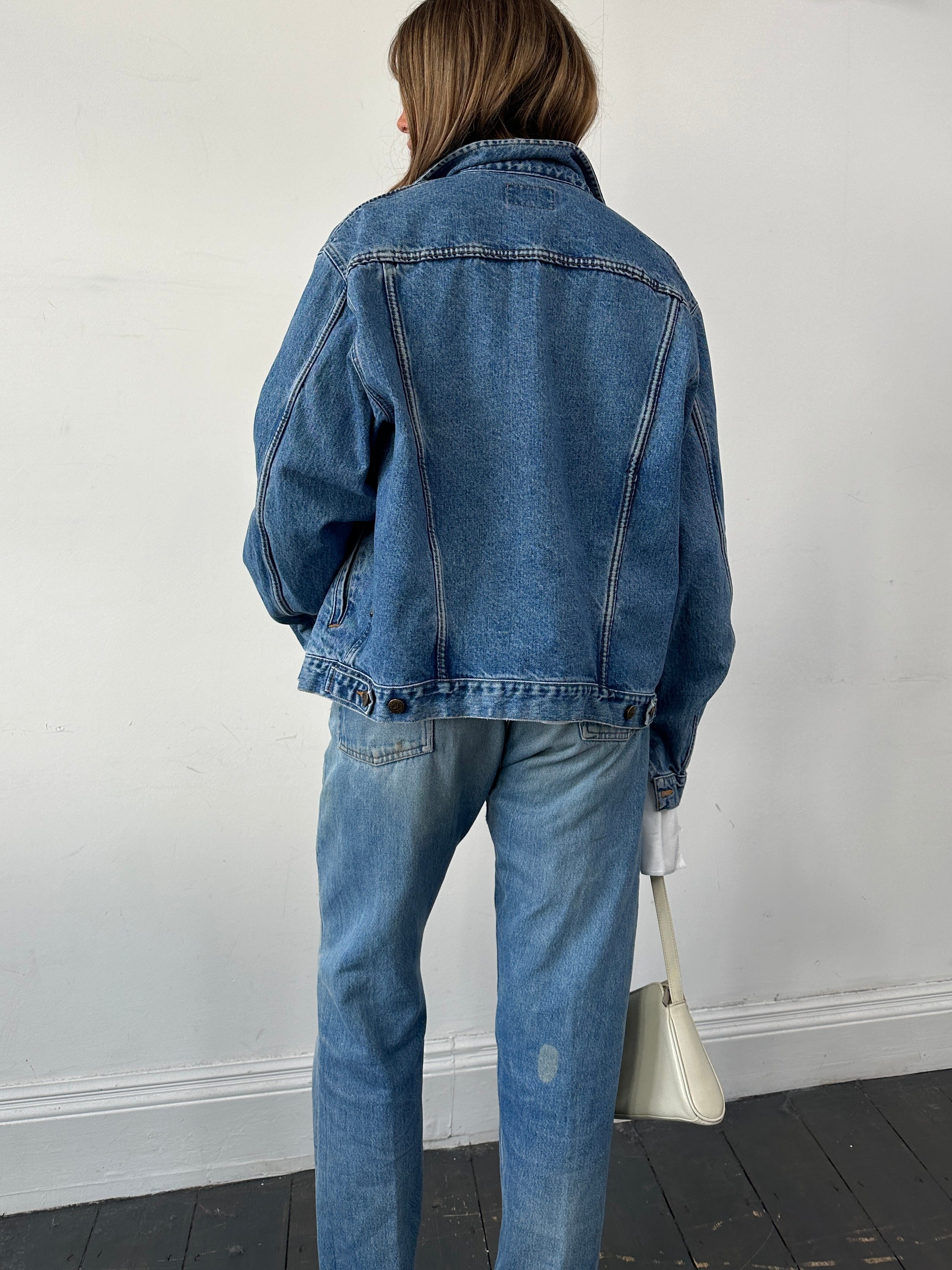 Armani Jeans mid wash denim jacket in size L, stylish casual outerwear with classic denim design and button closure.