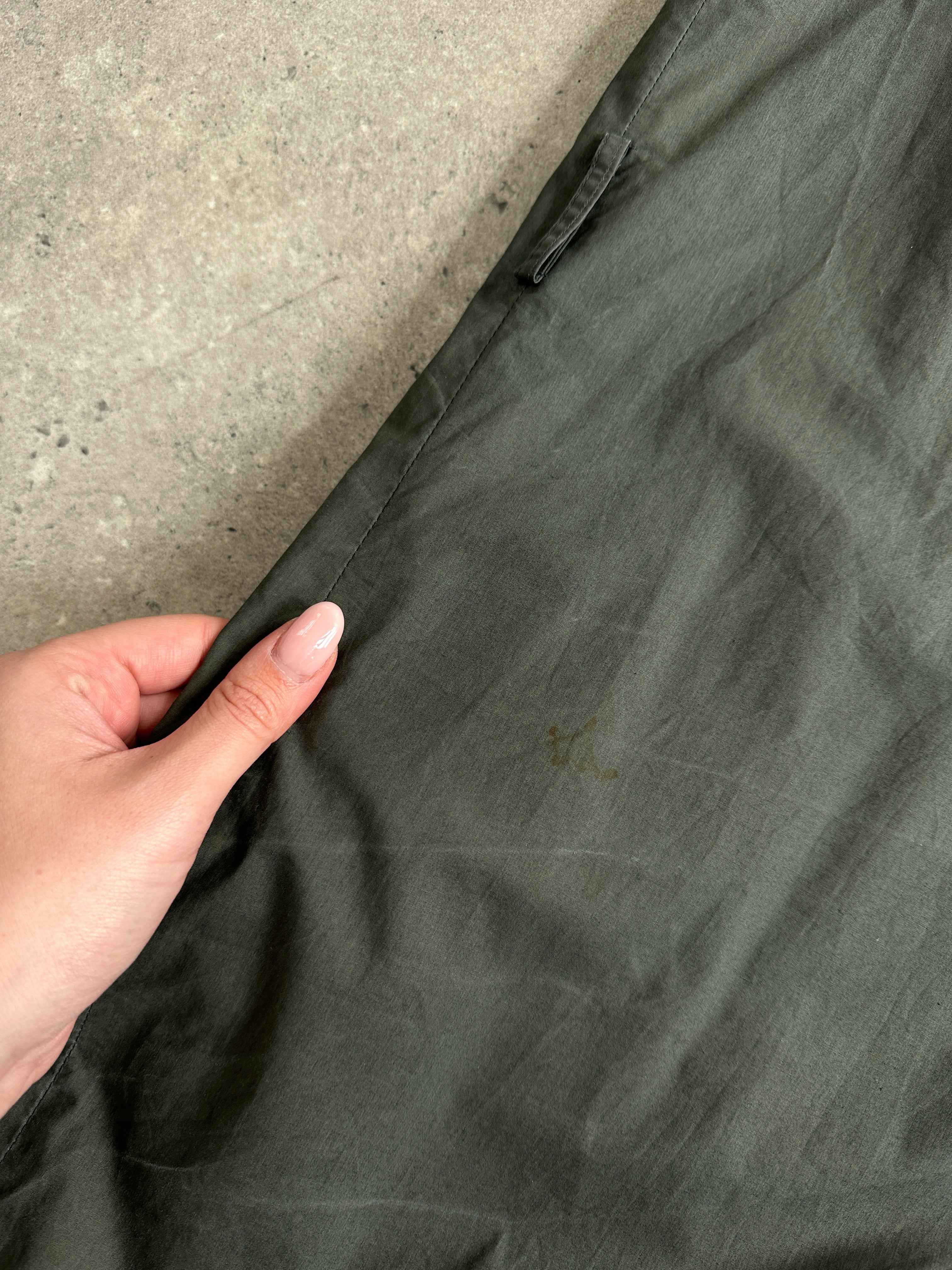 Yves Saint Laurent Diffusion Hommes cotton trench coat with concealed placket in size L, shown hanging on a hanger.