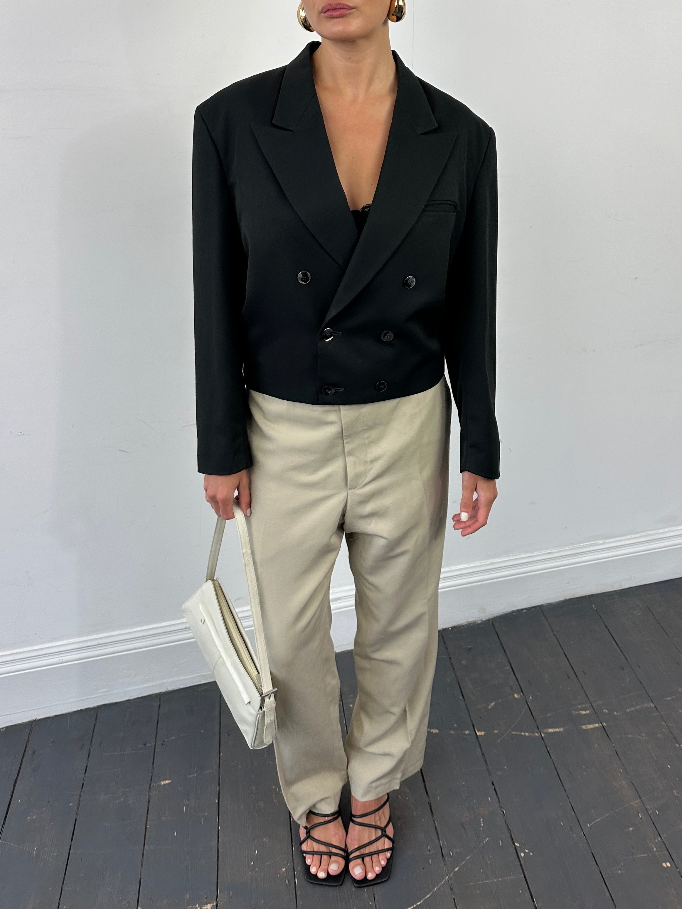 Vintage 1980s cropped double-breasted blazer, stylish and tailored, in classic fashion with a fitted silhouette.