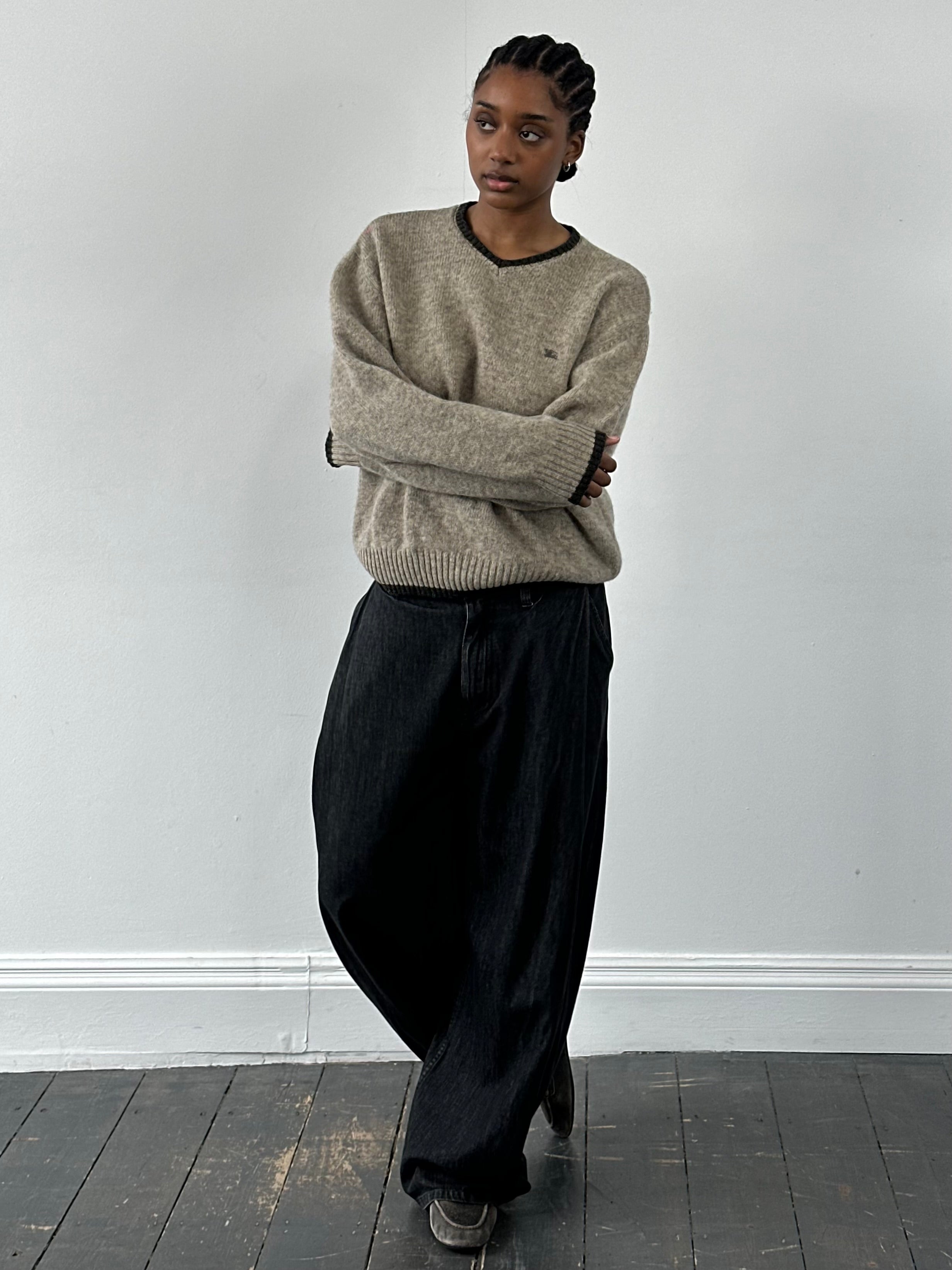 Burberry London 2000s merino wool V-neck knitted jumper in size M/L, featuring classic Burberry design and soft wool texture.