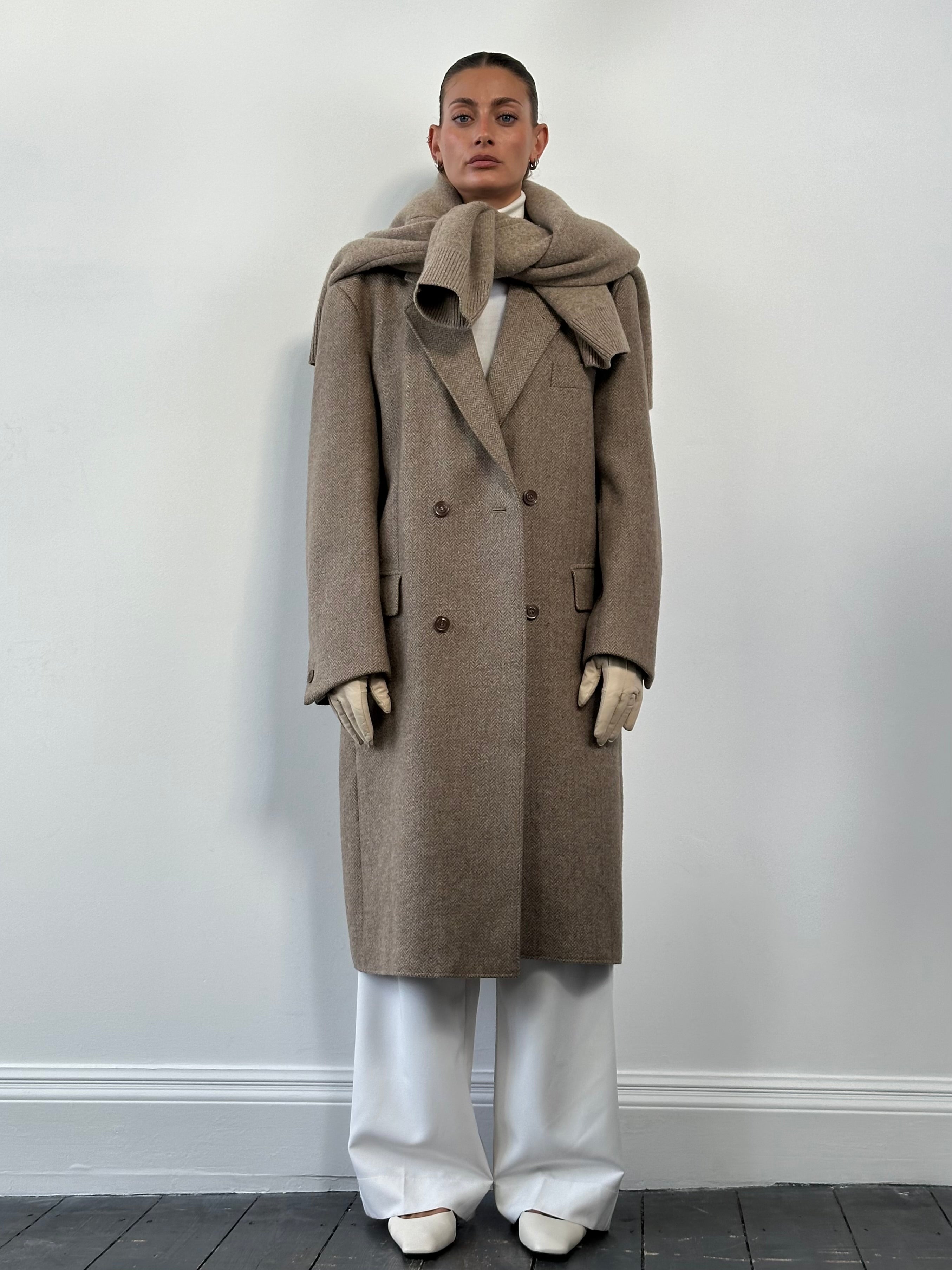 Vintage wool herringbone double-breasted coat in XL size, showcasing classic style and textured fabric details.