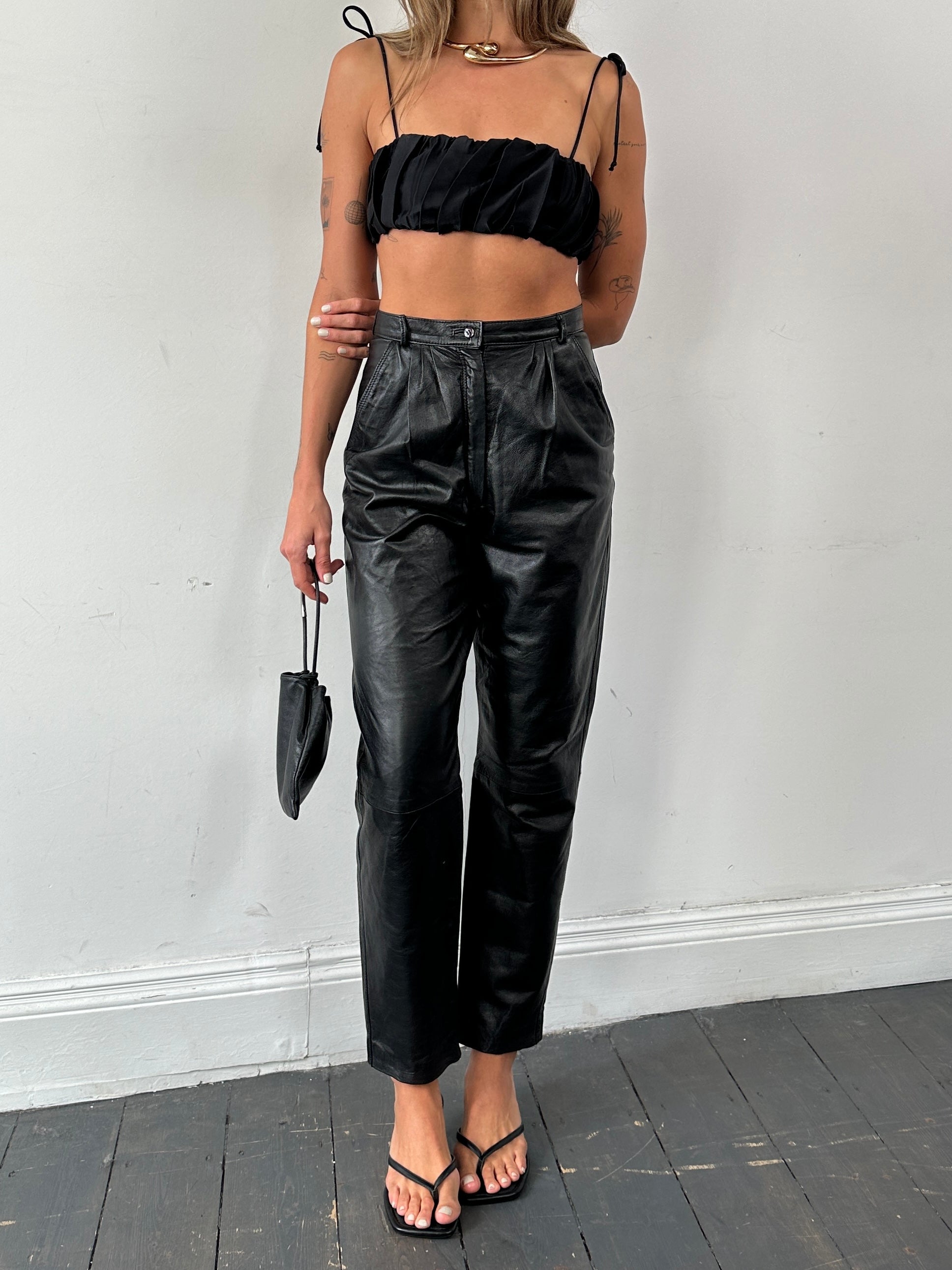 Italian Vintage high-waisted tapered leg leather trousers, size W26, featuring classic vintage leather design and high-rise fit.