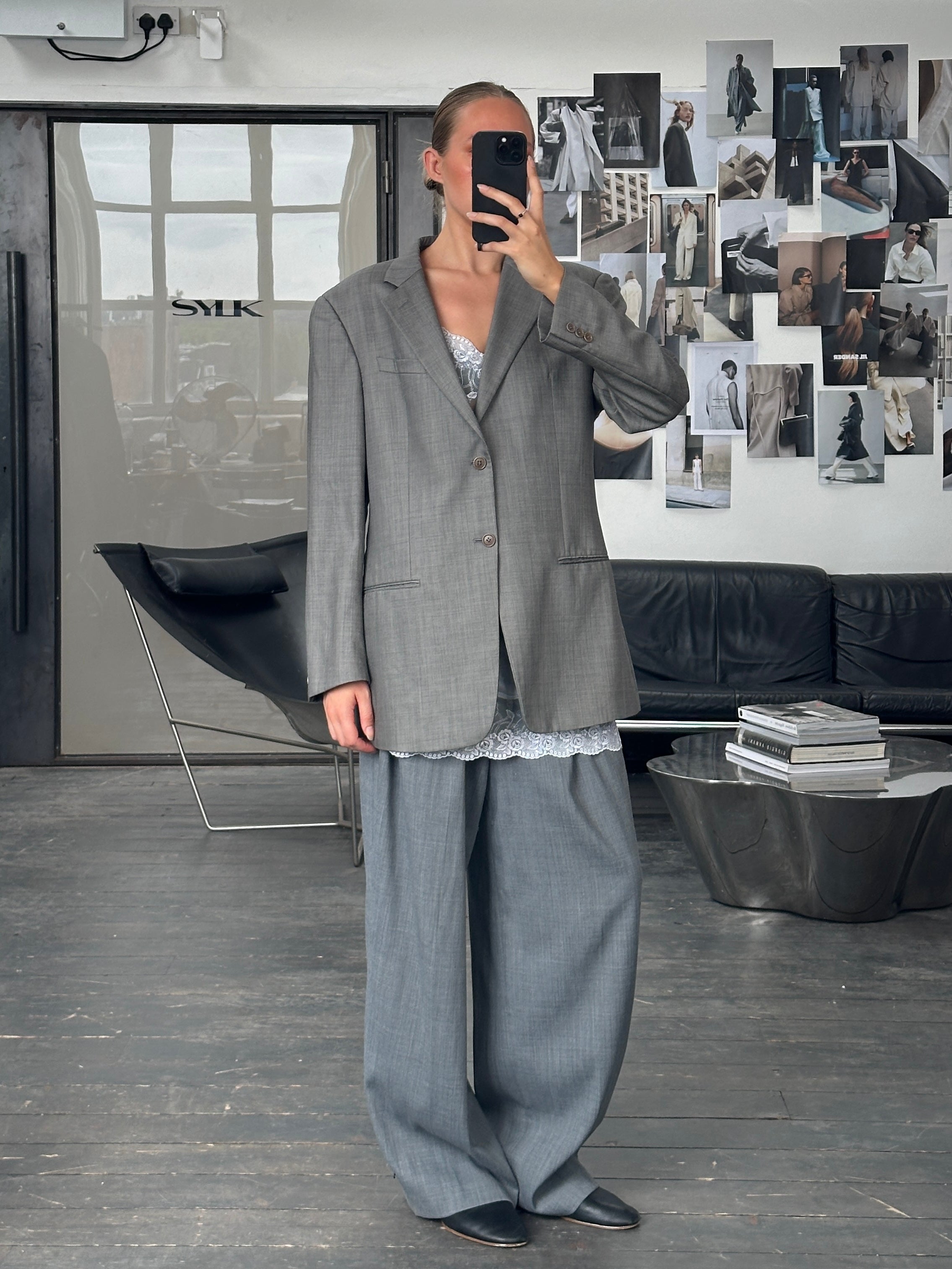 Armani Collezioni 2000s pure wool single-breasted blazer in size 42L/XL, shown in classic dark color with notch lapel.