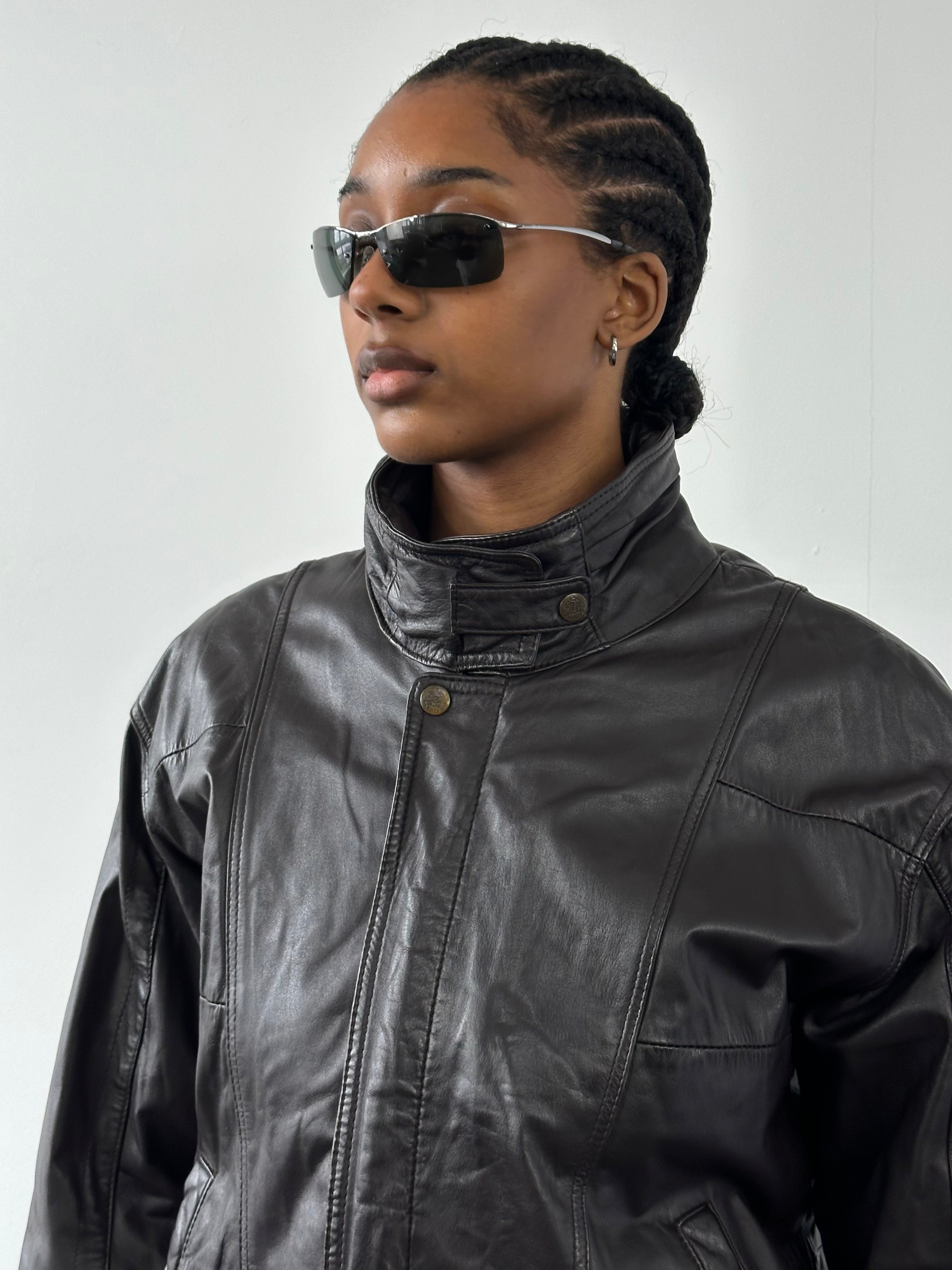 Valentino 1990s high neck leather bomber jacket in black, front view showing sleek design and stitching details.