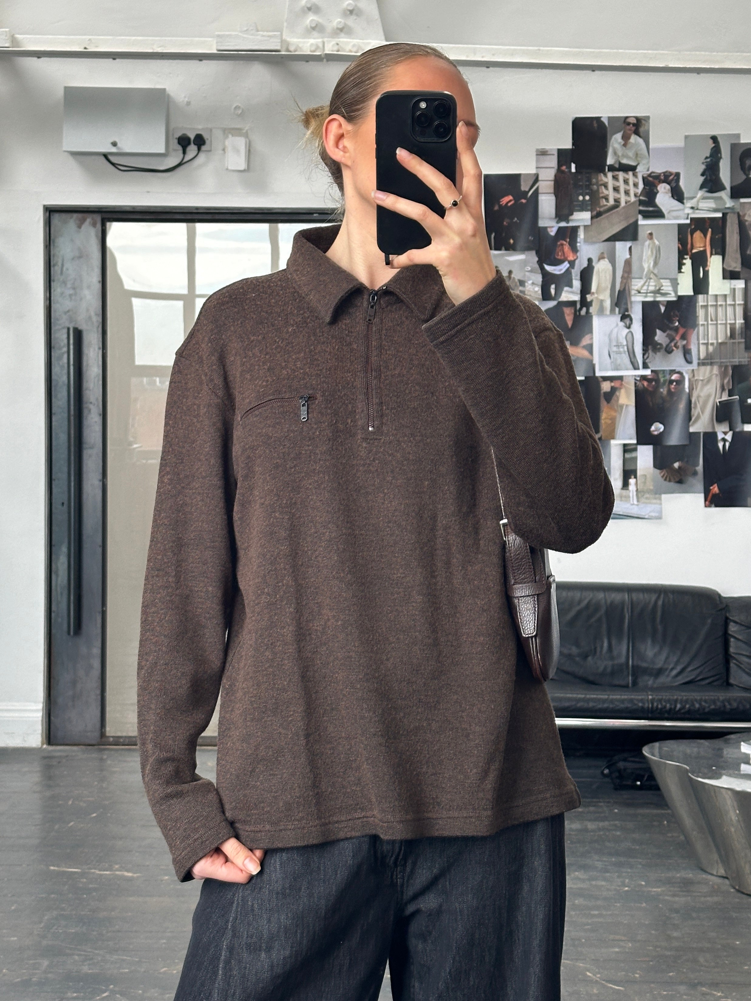 Armani Jeans 1990s wool quarter zip jumper in size large, navy blue with ribbed collar and cuffs, displayed on a hanger.