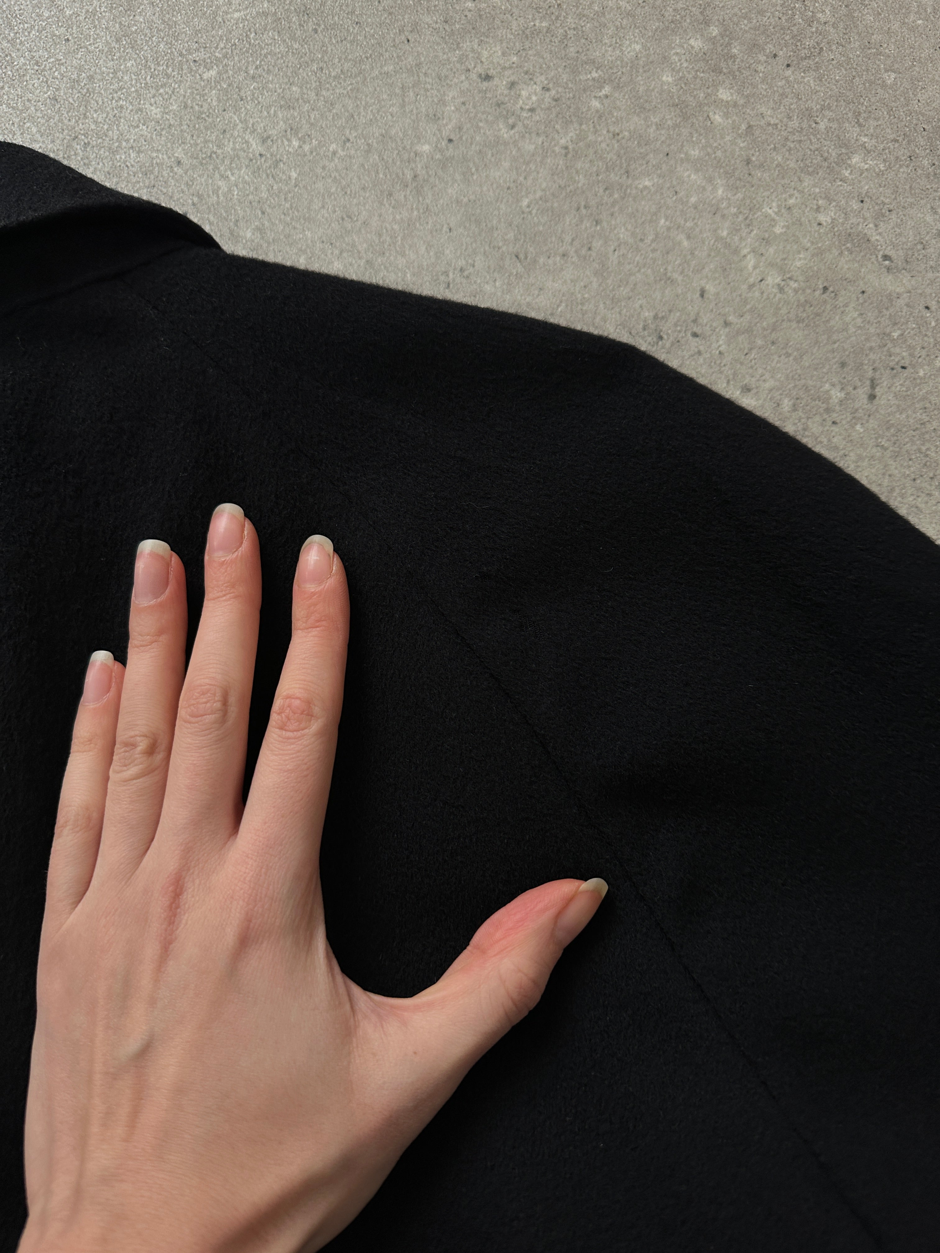 Givenchy 1990s pure wool coat with concealed placket, oversized XL style, featuring classic tailored design and neutral color.