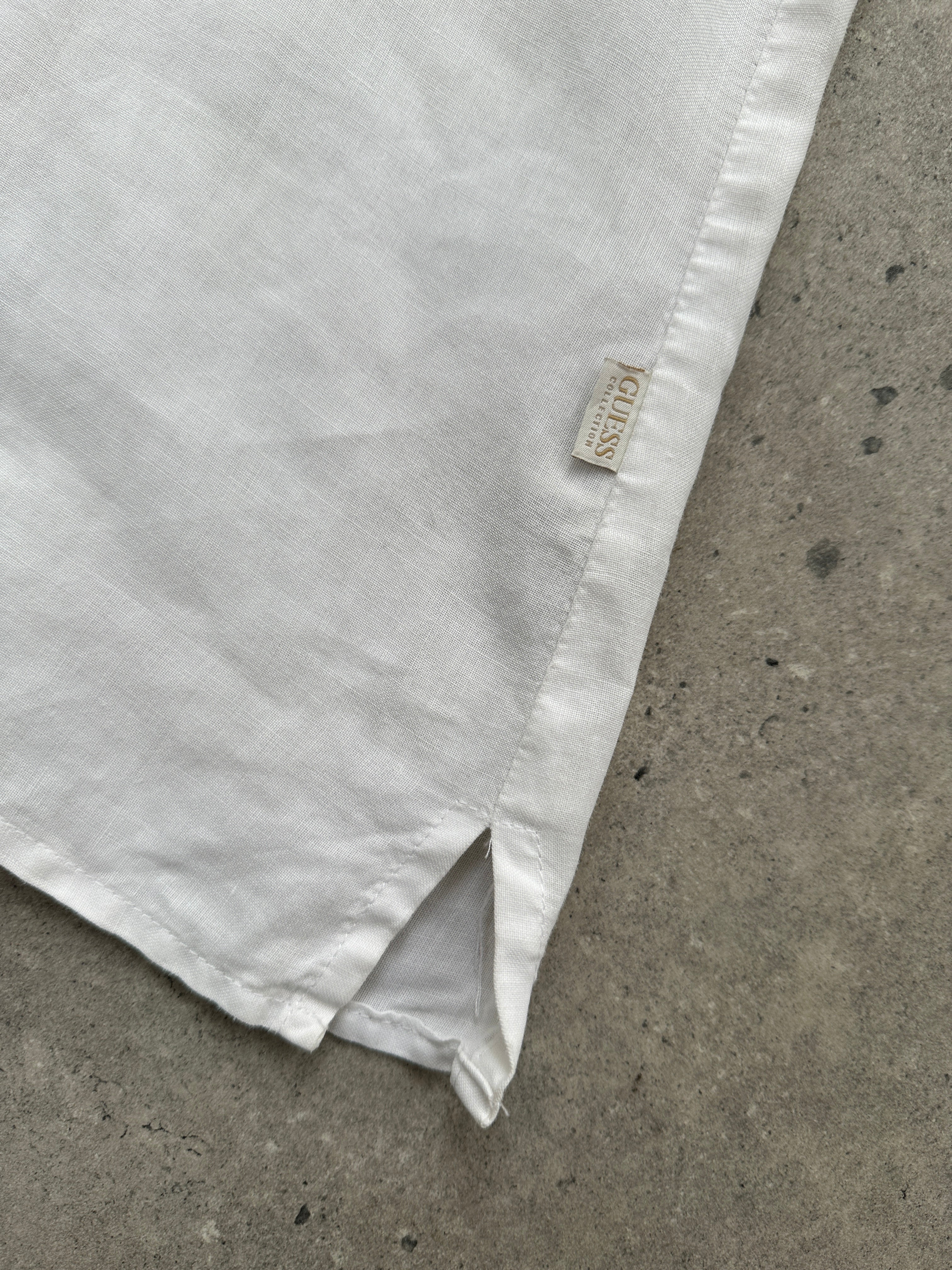 Guess Pure Linen Sheer Short Sleeve Shirt in white, lightweight and breathable, displayed on a mannequin.