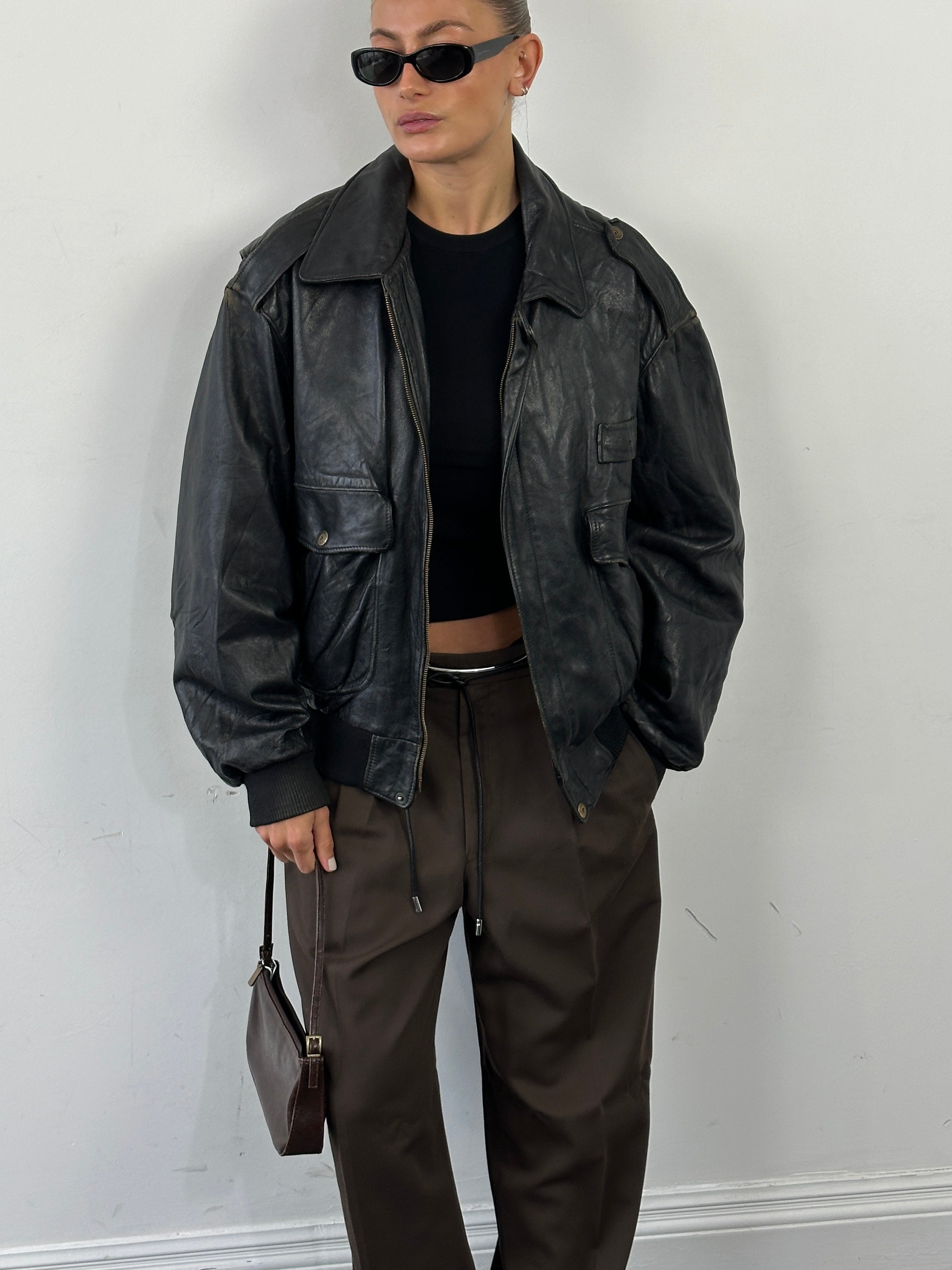 Vintage Italian leather bomber jacket with removable fleece lining, size large, stylish and warm for casual wear.