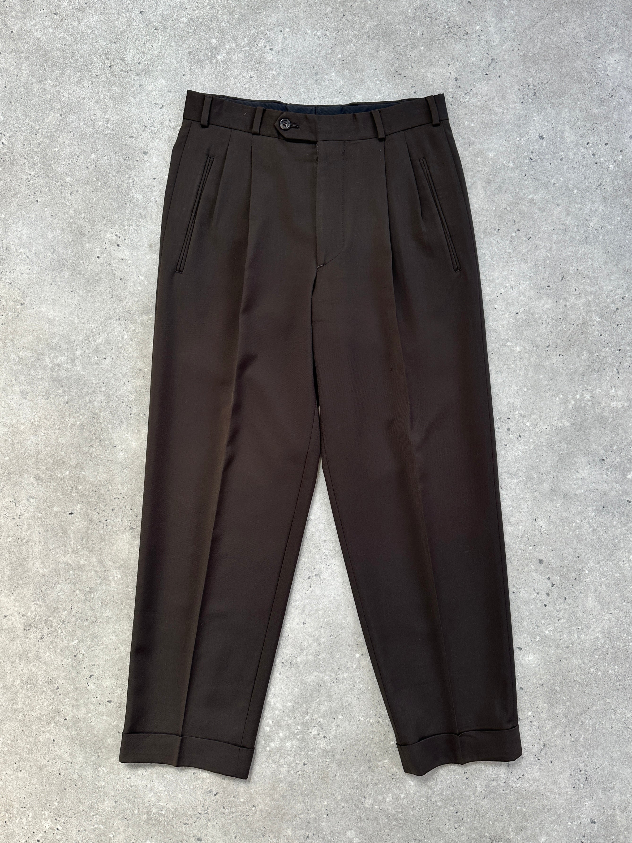 Yves Saint Laurent Pour Homme 1990s tailored wool trousers in dark fabric, front view with waistband and tailored fit, size W28