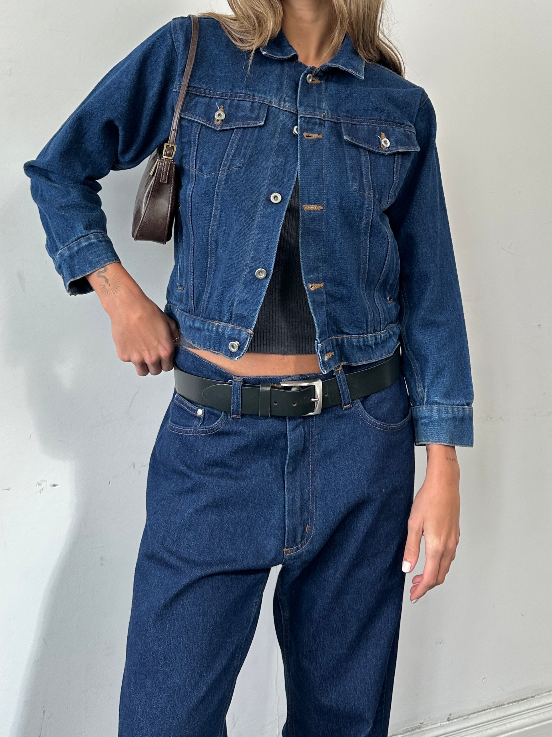 Vintage brand vintage indigo denim jacket with button-up front, XS/S size, featuring classic stitching and a casual fit.