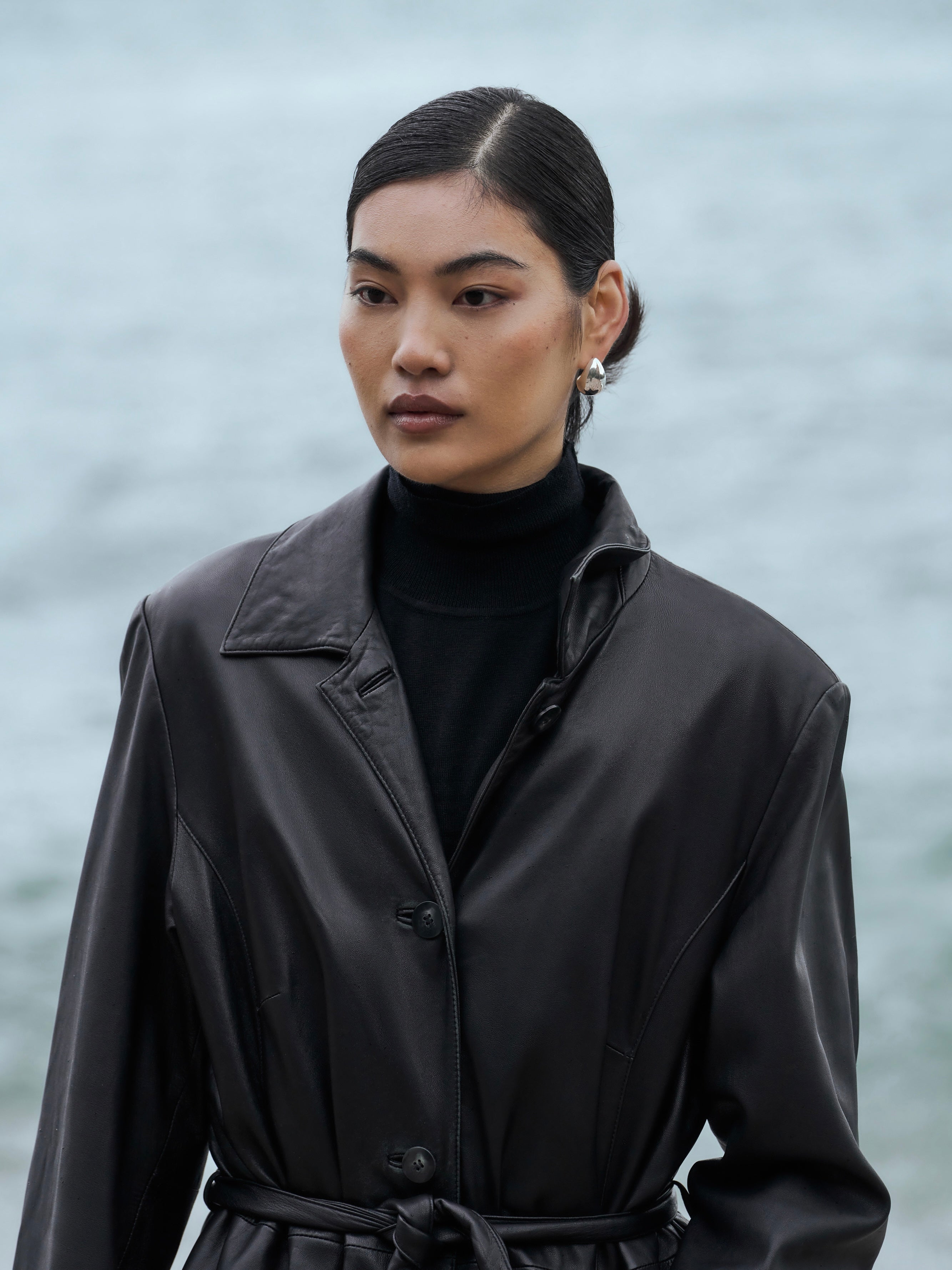 Vintage leather trench coat, floor length belted design in XL, stylish vintage leather jacket with classic silhouette.