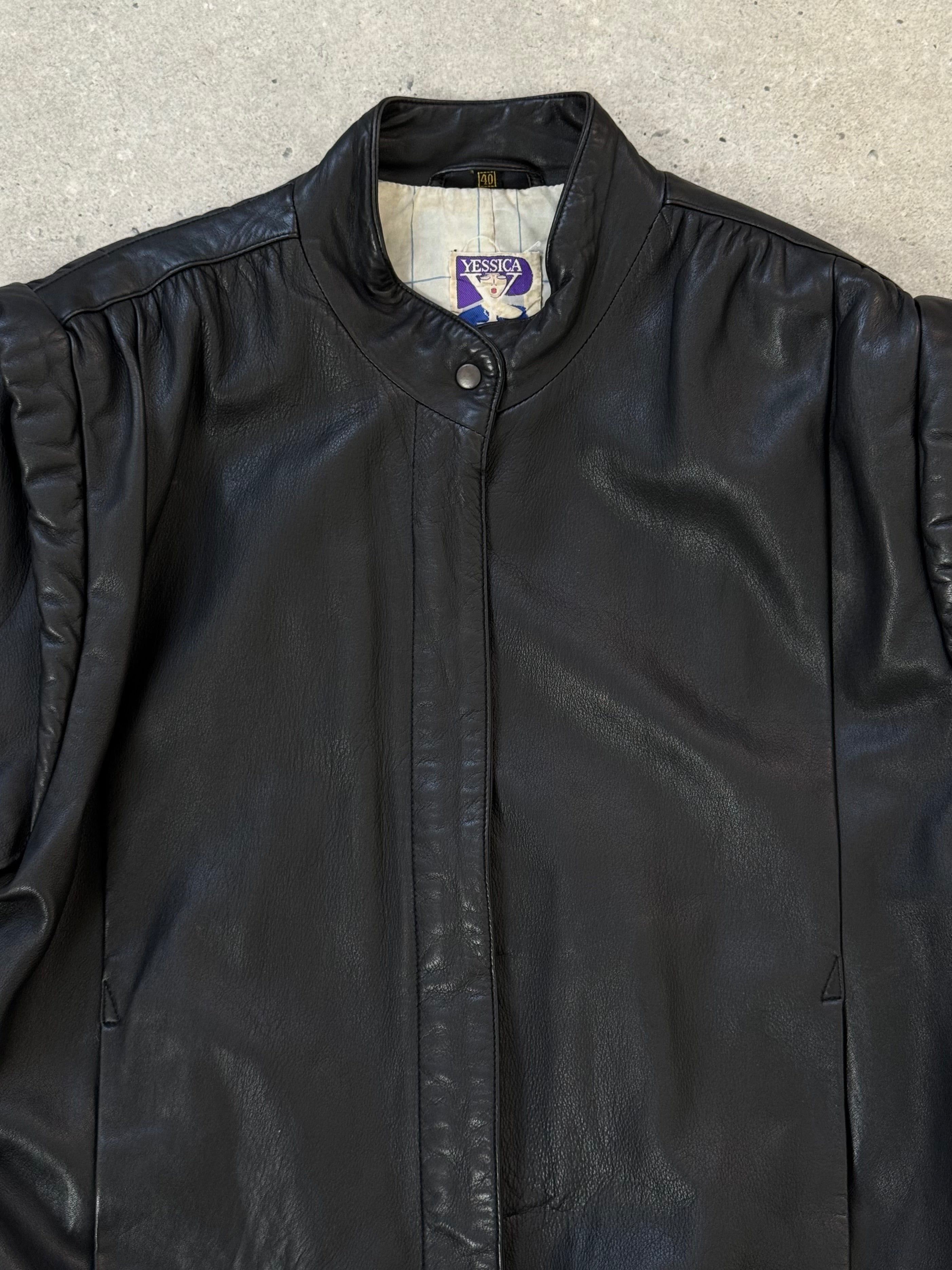 Vintage 1990s leather bomber jacket in medium size, featuring classic design and brown leather material.