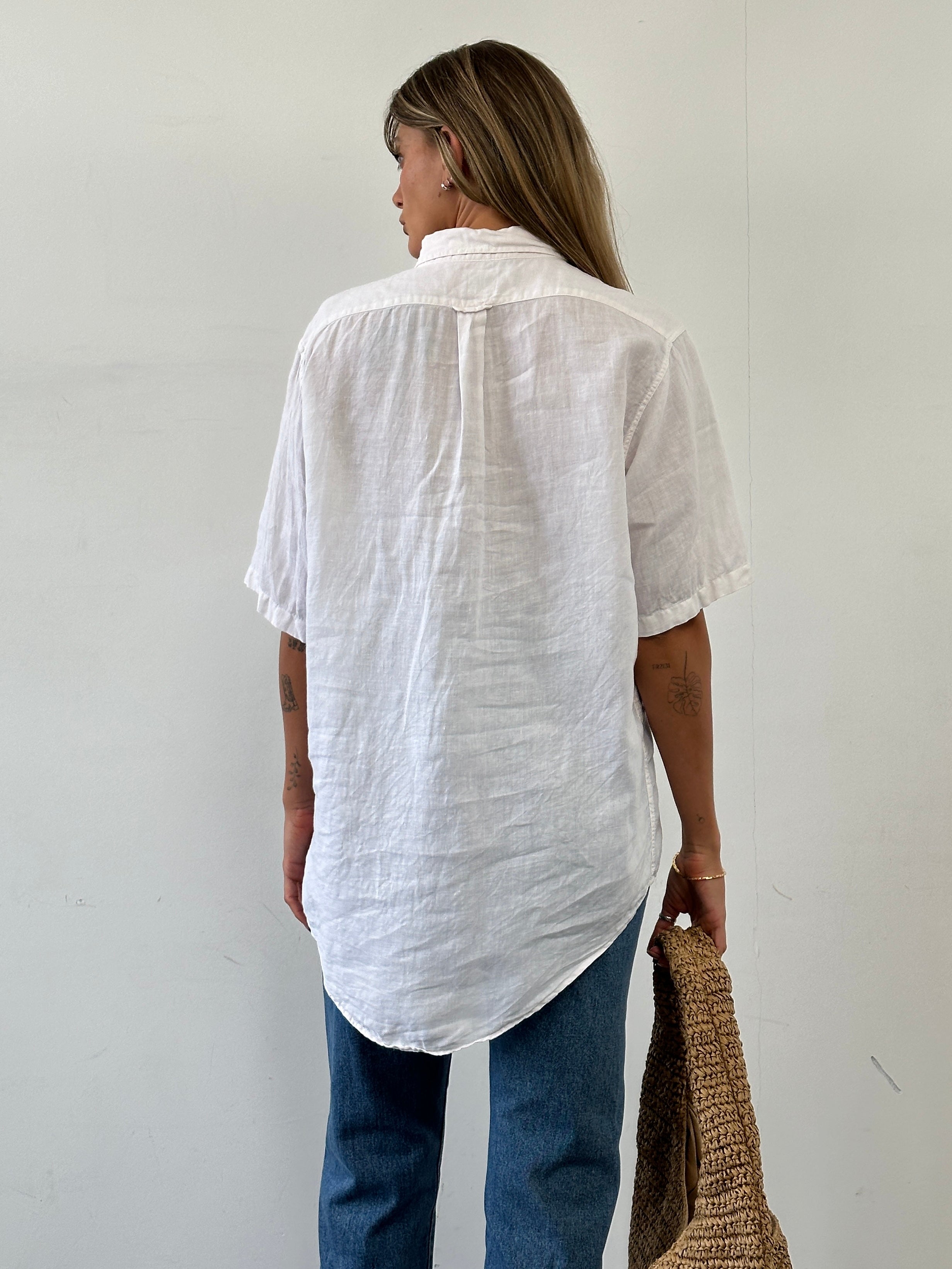 Moschino pure linen logo short sleeve shirt in size L/XL, featuring a casual fit with Moschino branding on the front.