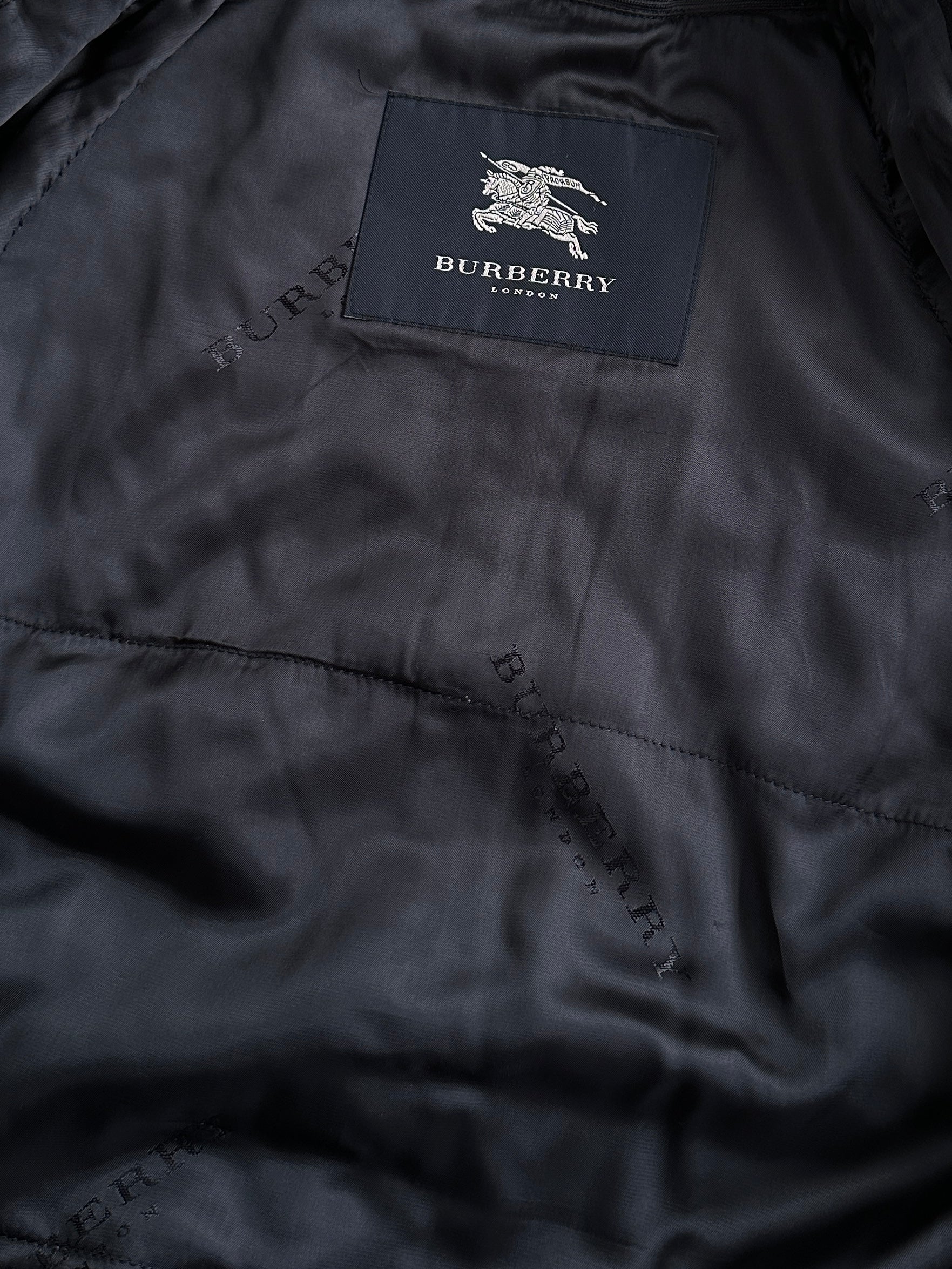 Burberry London 1990s wool single-breasted logo coat in size L/XL, featuring classic design and signature check pattern.