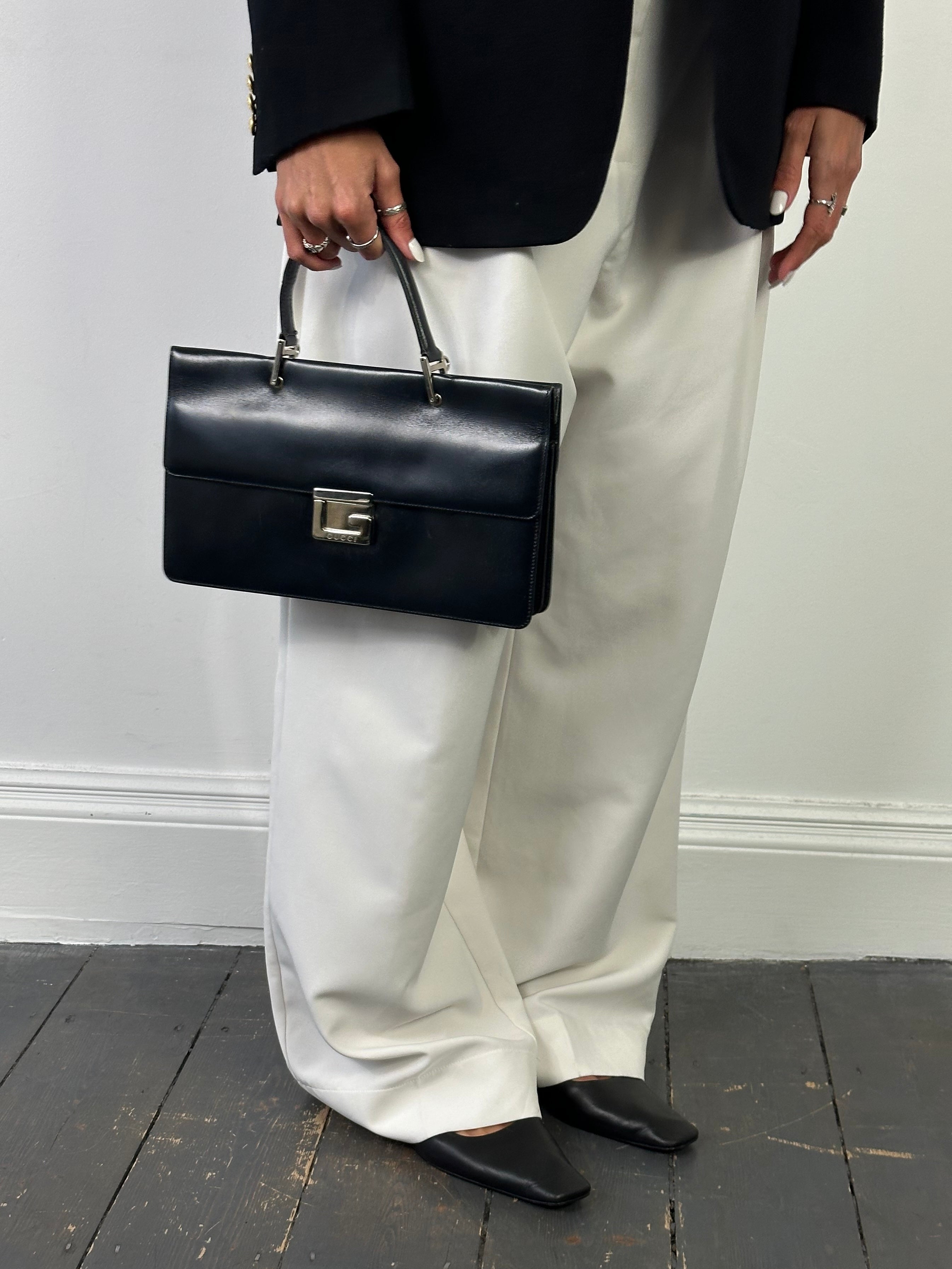 Gucci 1990s Tom Ford Square G leather handbag with structured design and gold-tone hardware, featuring a top handle and signature style.