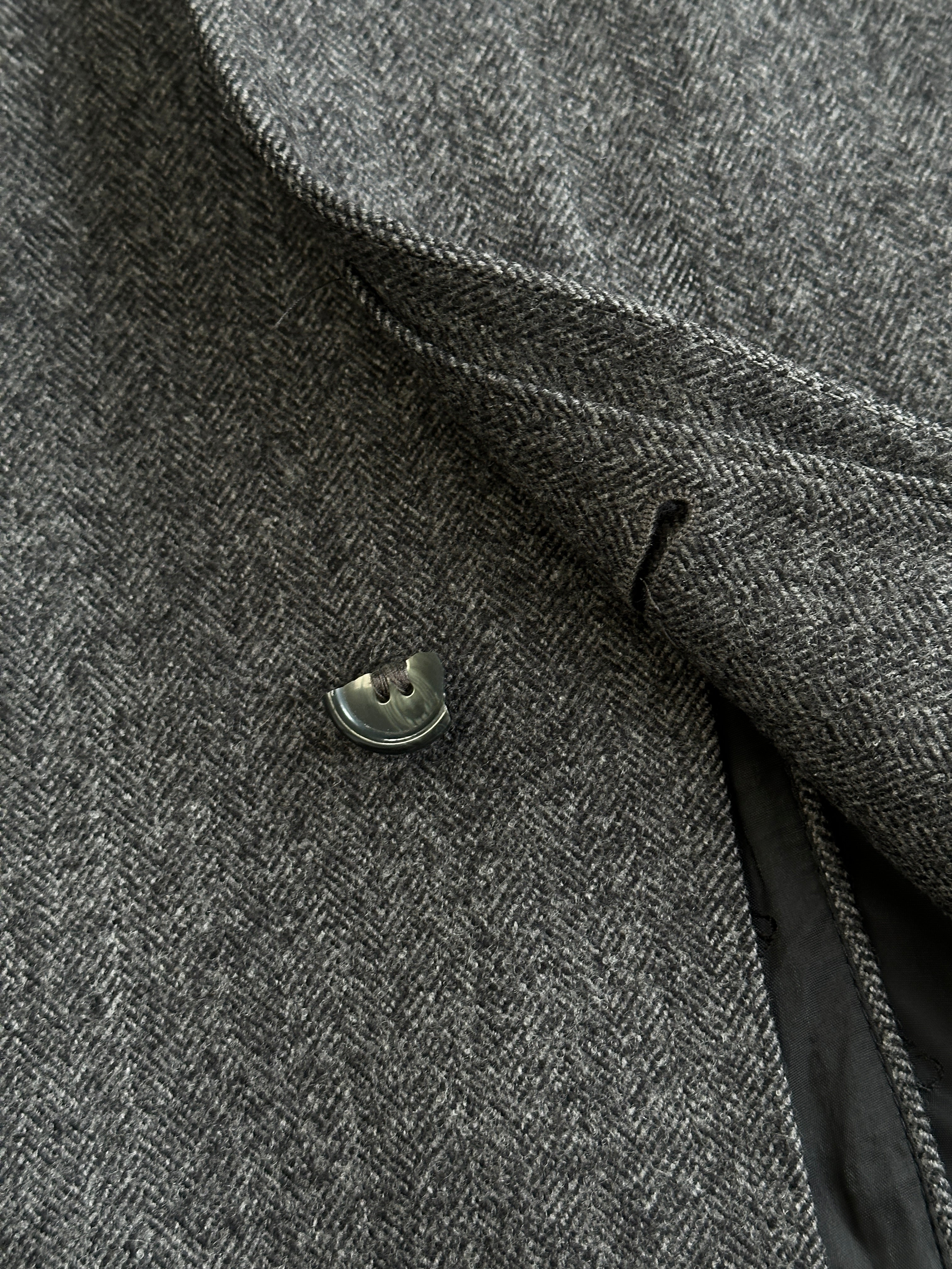 Christian Dior pure wool single-breasted coat in size L/XL, shown in a stylish, tailored design with a classic collar and button closure.