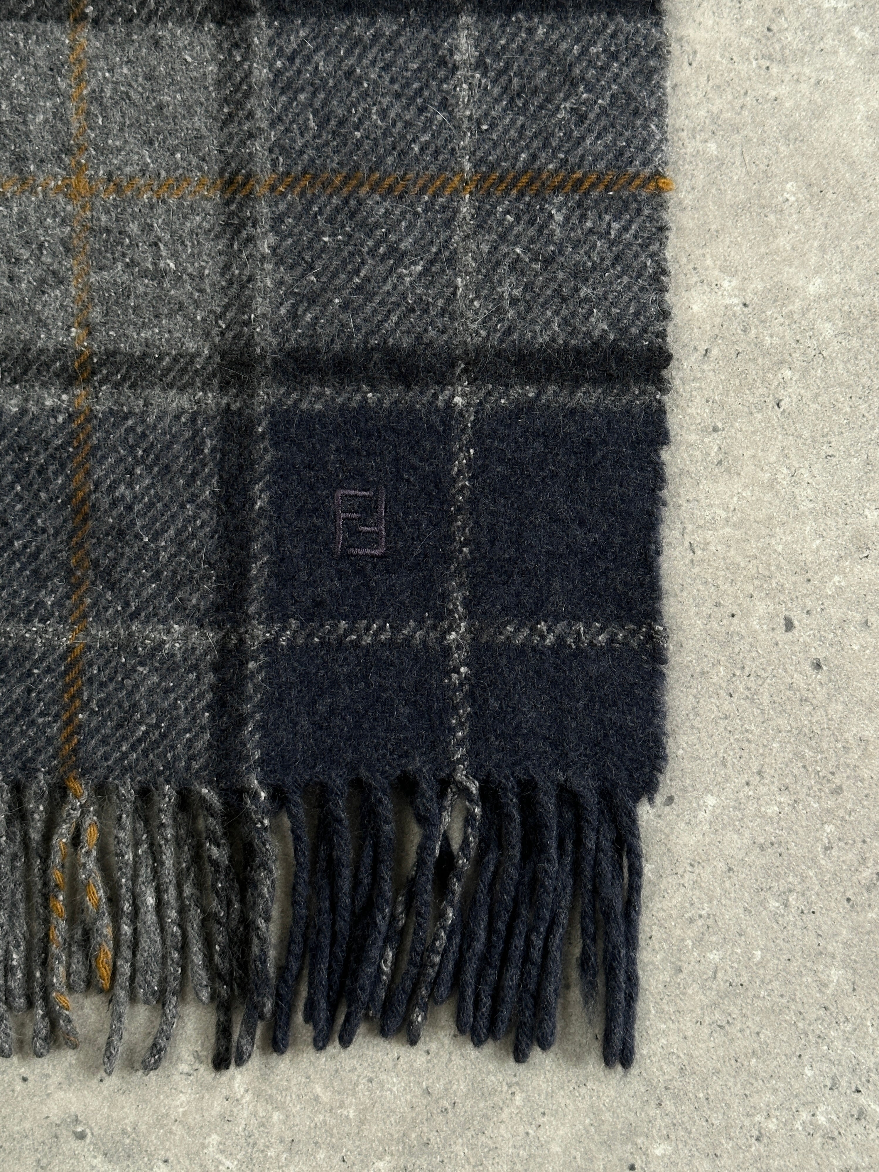 Fendi pure wool logo check scarf with classic pattern, featuring the iconic Fendi branding and stylish design.