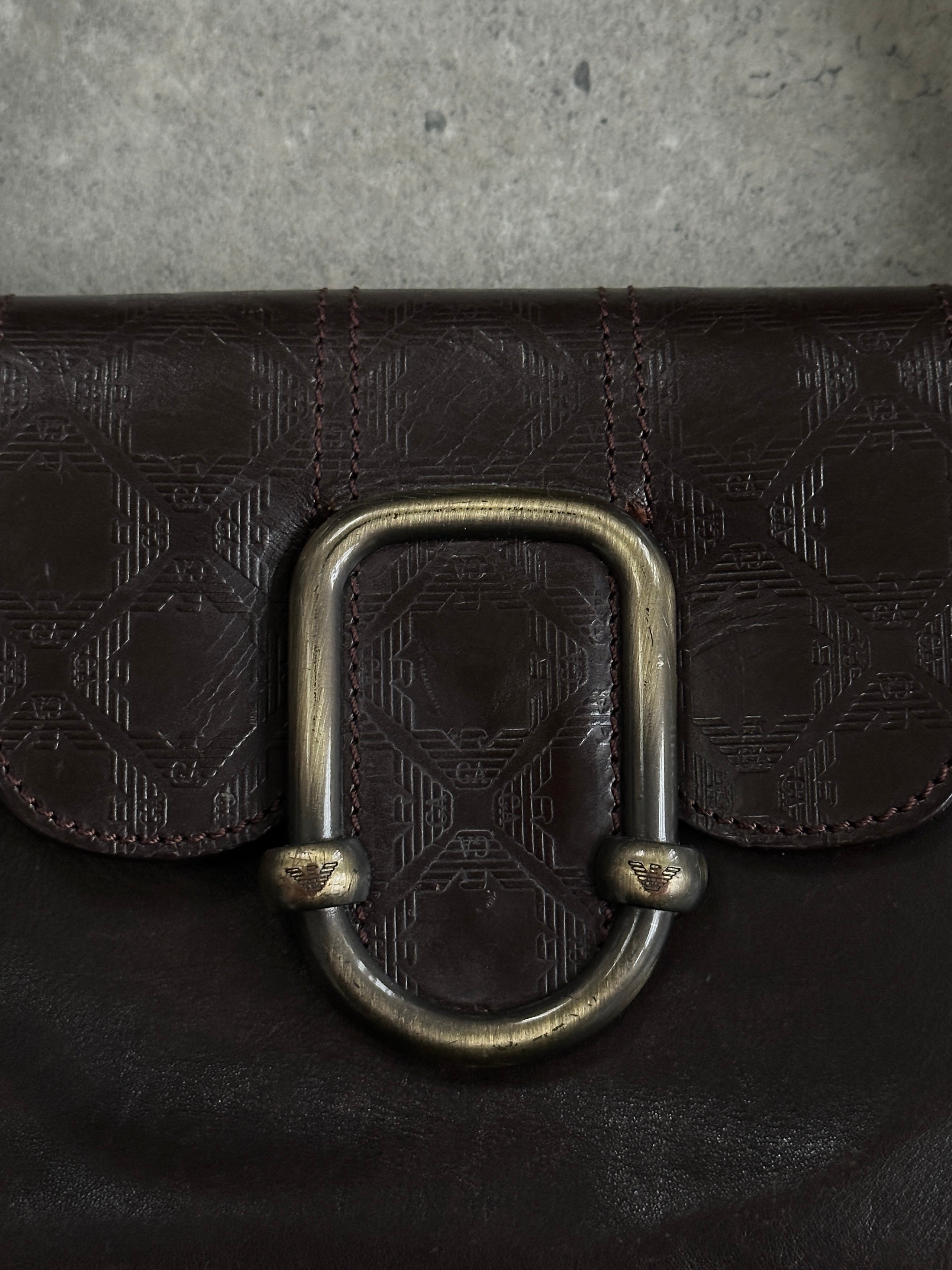 Emporio Armani leather shoulder bag with hardware monogram, featuring a sleek design and adjustable strap.