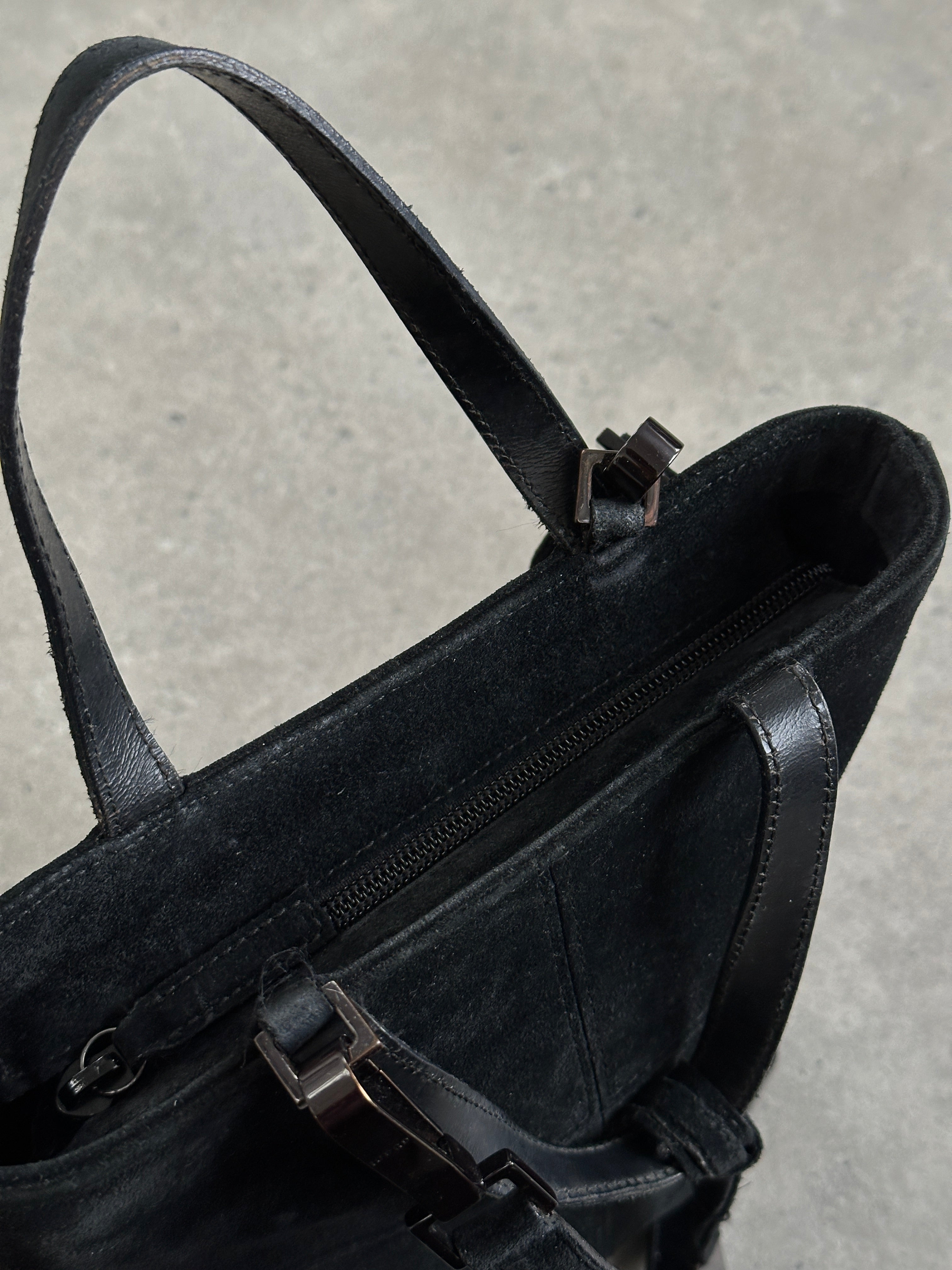 Gucci 2000s suede top handle crossbody bag with gold hardware and adjustable strap, stylish and vintage-inspired accessory.